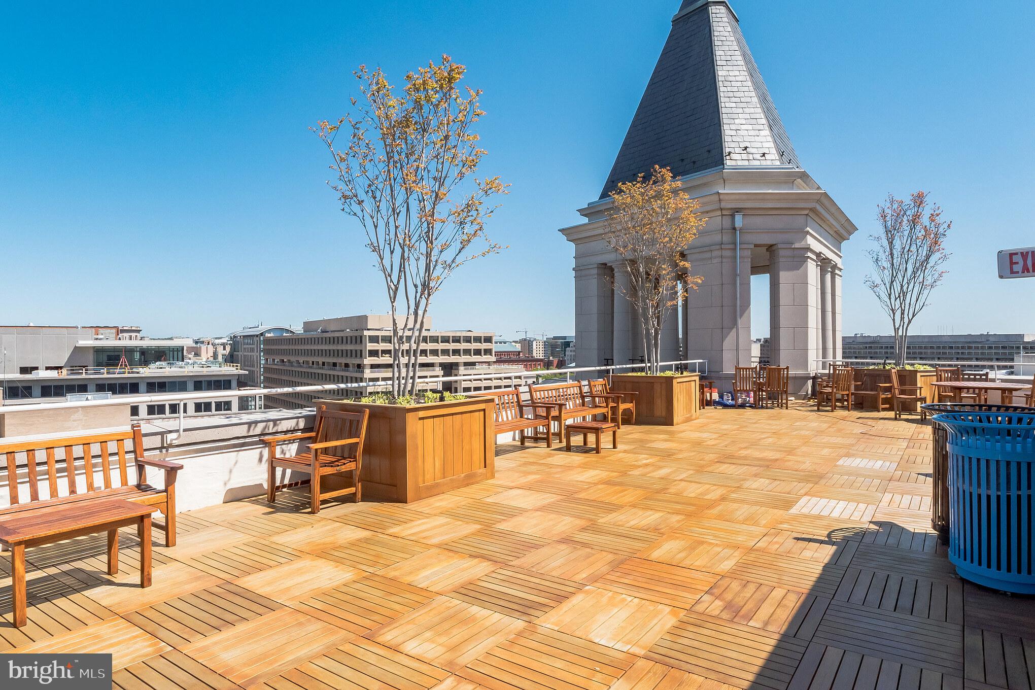 601 Pennsylvania Avenue Northwest, Unit 705 Washington, DC 20004 - Photo 24 of 29 a view of a swimming pool with a lounge chairs