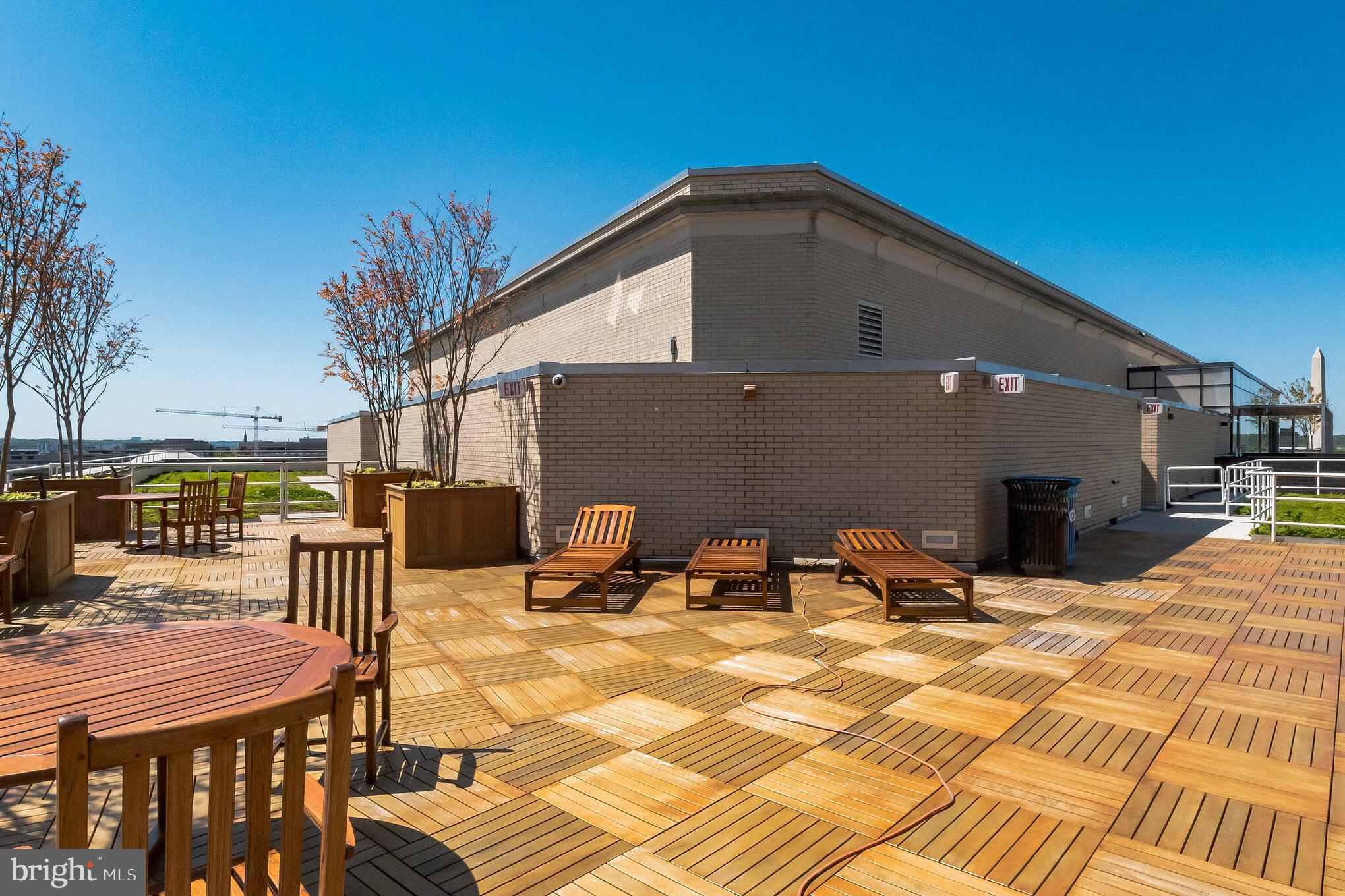 601 Pennsylvania Avenue Northwest, Unit 705 Washington, DC 20004 - Photo 25 of 29 a view of a dinning table and chairs in the patio