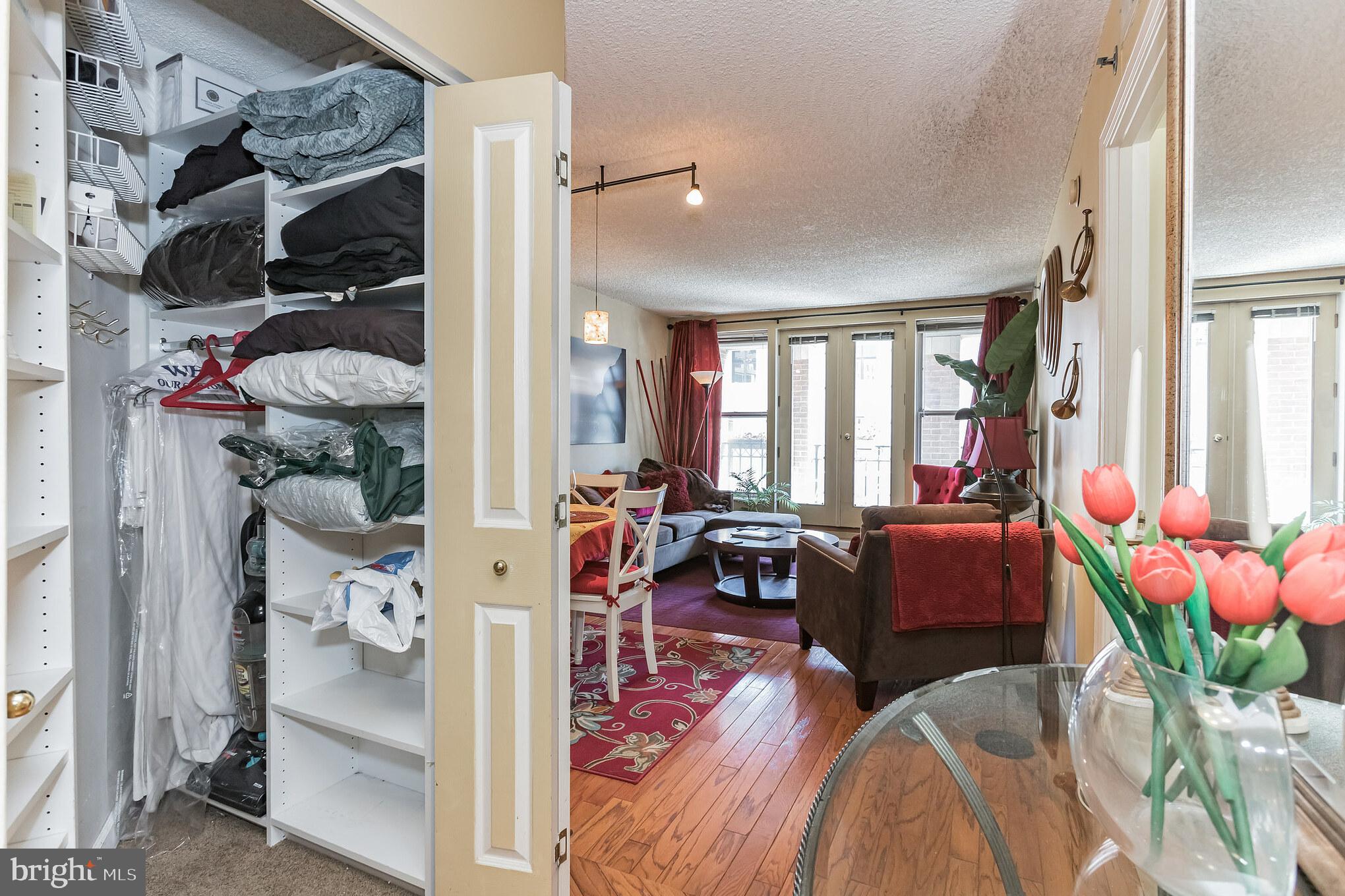 601 Pennsylvania Avenue Northwest, Unit 705 Washington, DC 20004 - Photo 7 of 29 a view of living room filled with furniture and a chandelier