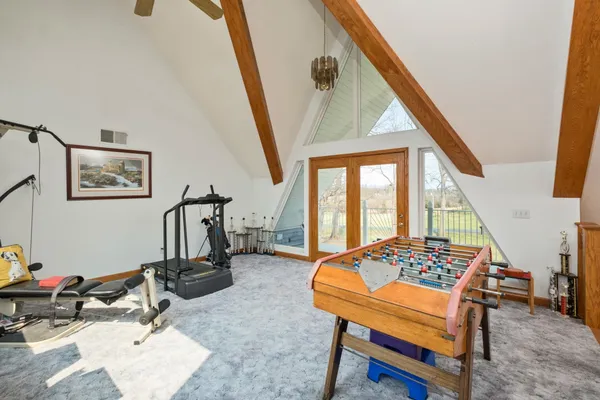 a kitchen with stainless steel appliances granite countertop a refrigerator a stove and a sink
