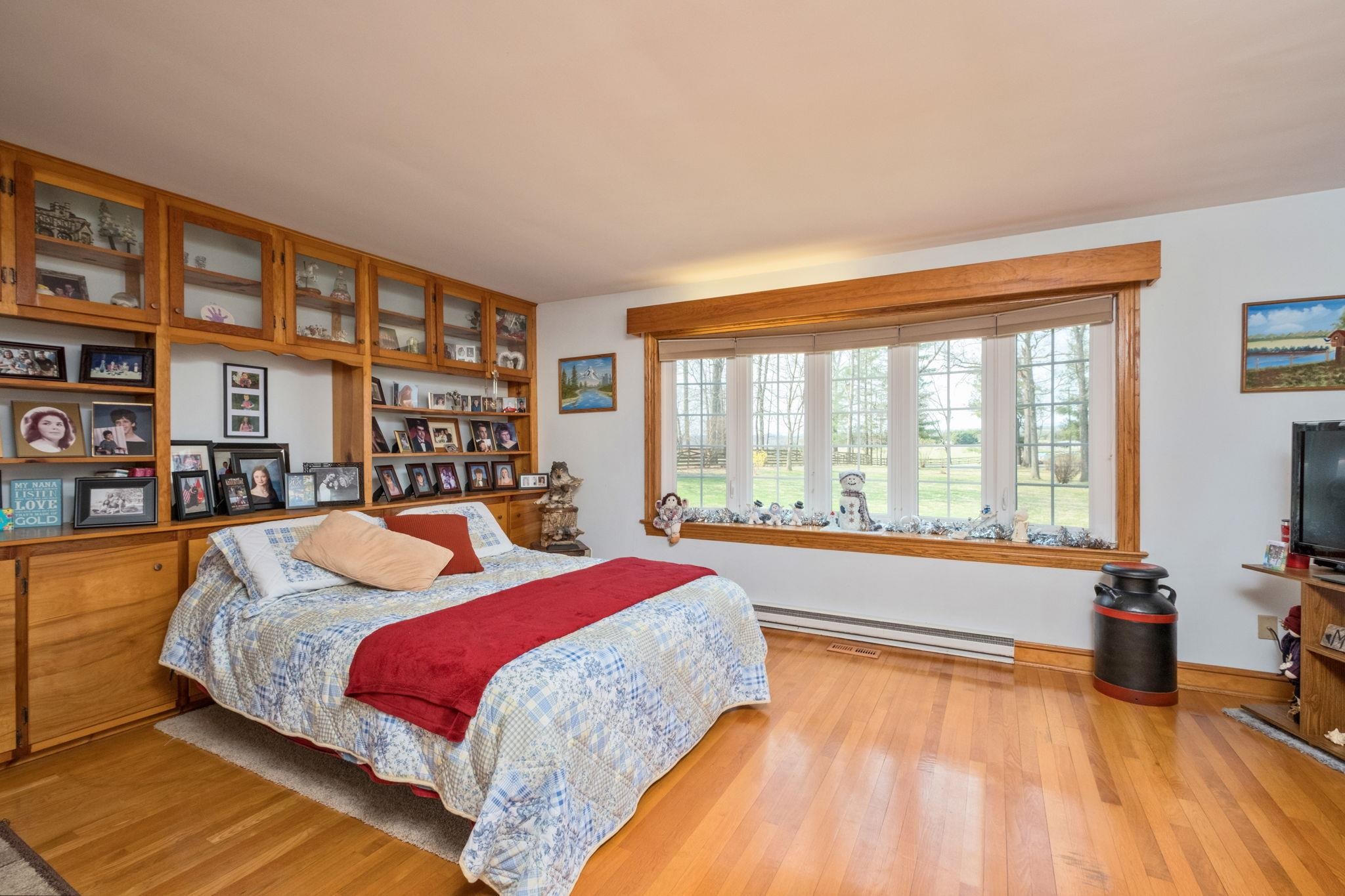 5640 Scotts Ford Road Mount Crawford, VA 22841 - Photo 39 of 68 a spacious bedroom with a bed and a large window