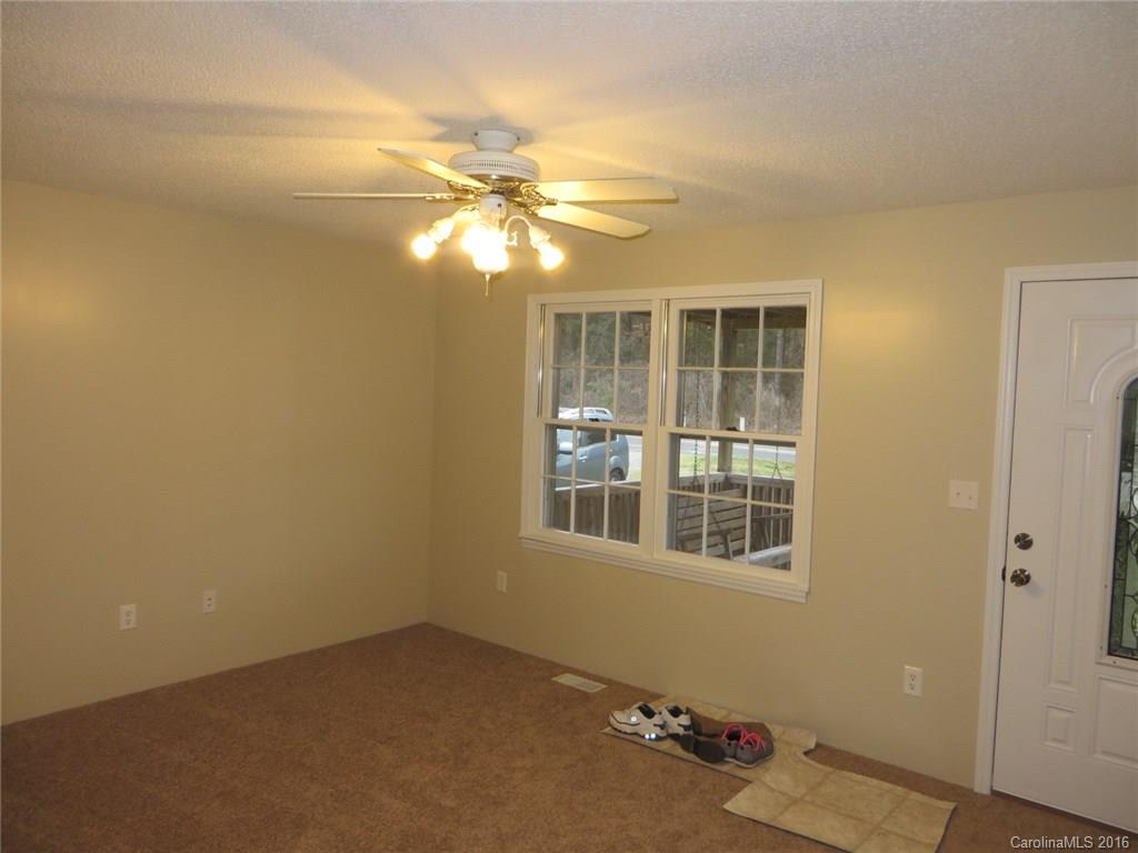 536 Blacksnake Road Stanley, NC 28164 - Photo 4 of 14 a view of an empty room with a window