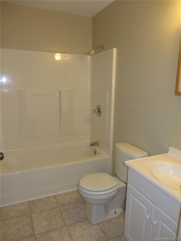 536 Blacksnake Road Stanley, NC 28164 - Photo 7 of 14 a bathroom with a toilet a sink and shower