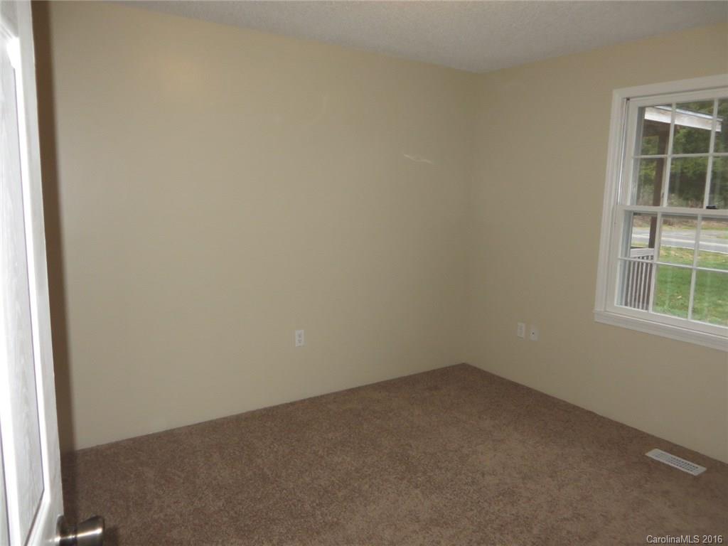 536 Blacksnake Road Stanley, NC 28164 - Photo 8 of 14 an empty room with a window
