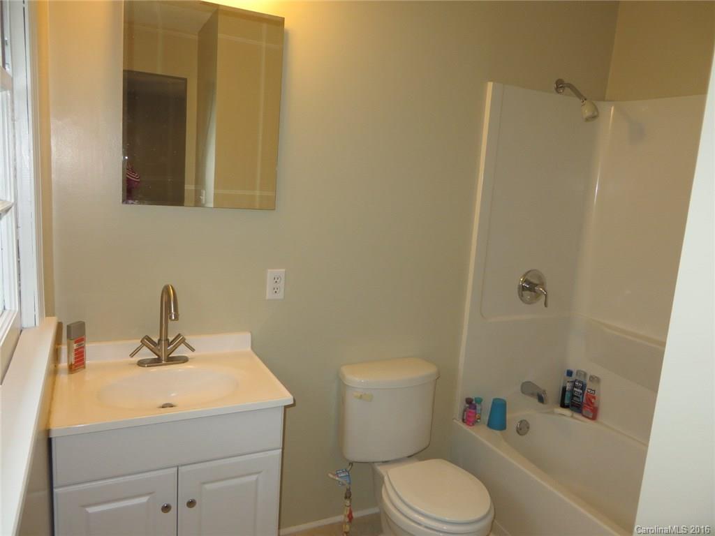 536 Blacksnake Road Stanley, NC 28164 - Photo 10 of 14 a bathroom with a sink toilet and shower