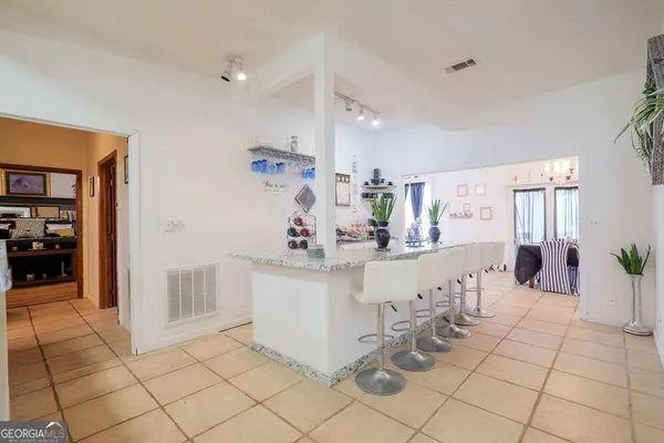 a view of a dining room with furniture window and outside view