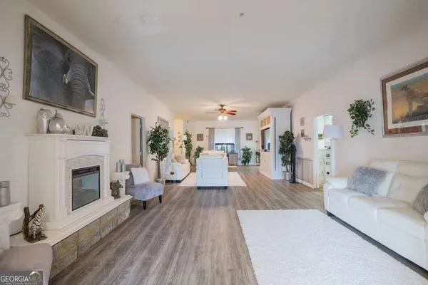 a living room with furniture and a fireplace