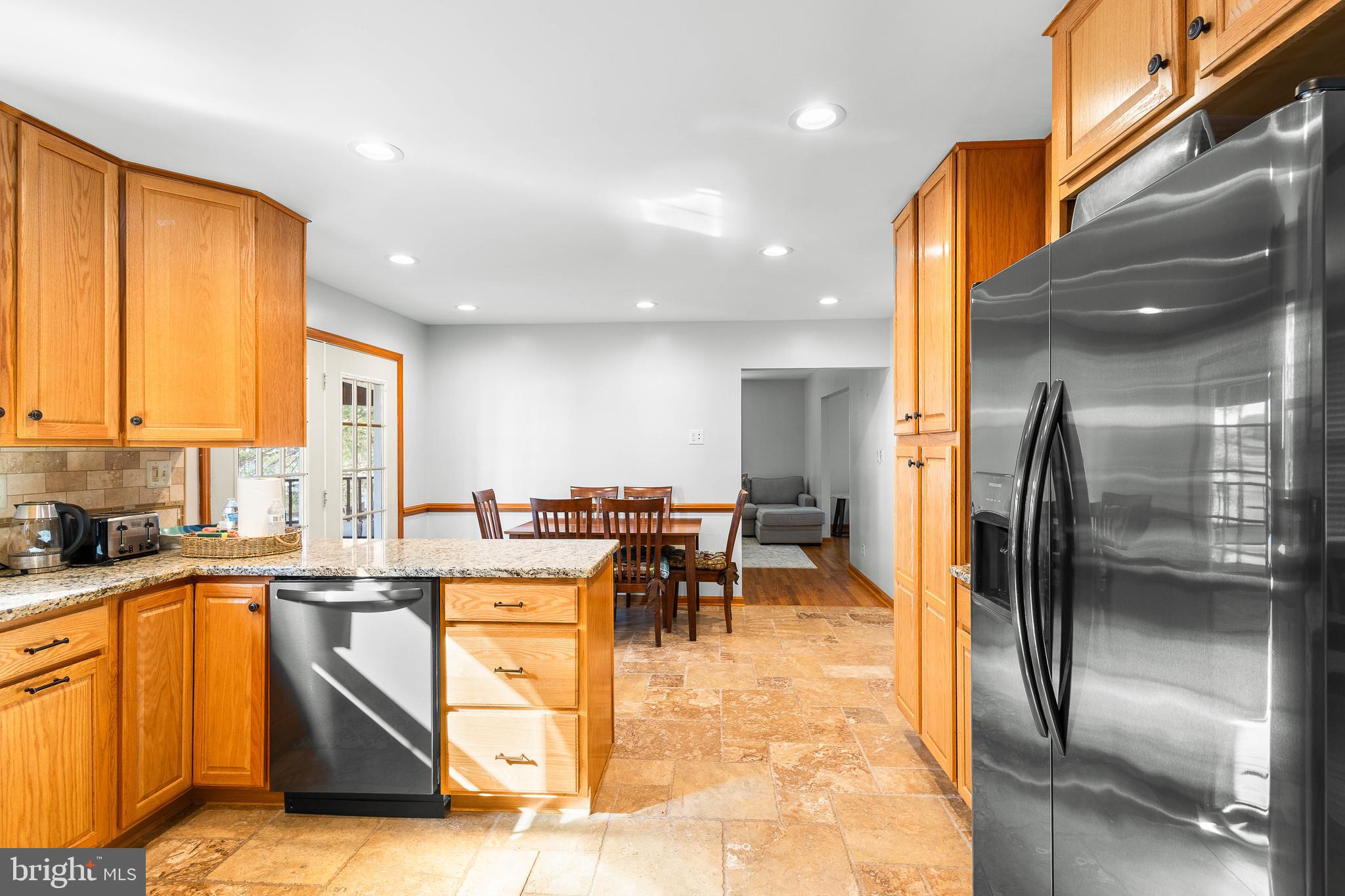 994 North Glebe Road Montross, VA 22520 - Photo 30 of 82 a kitchen with stainless steel appliances granite countertop a sink a stove and a refrigerator