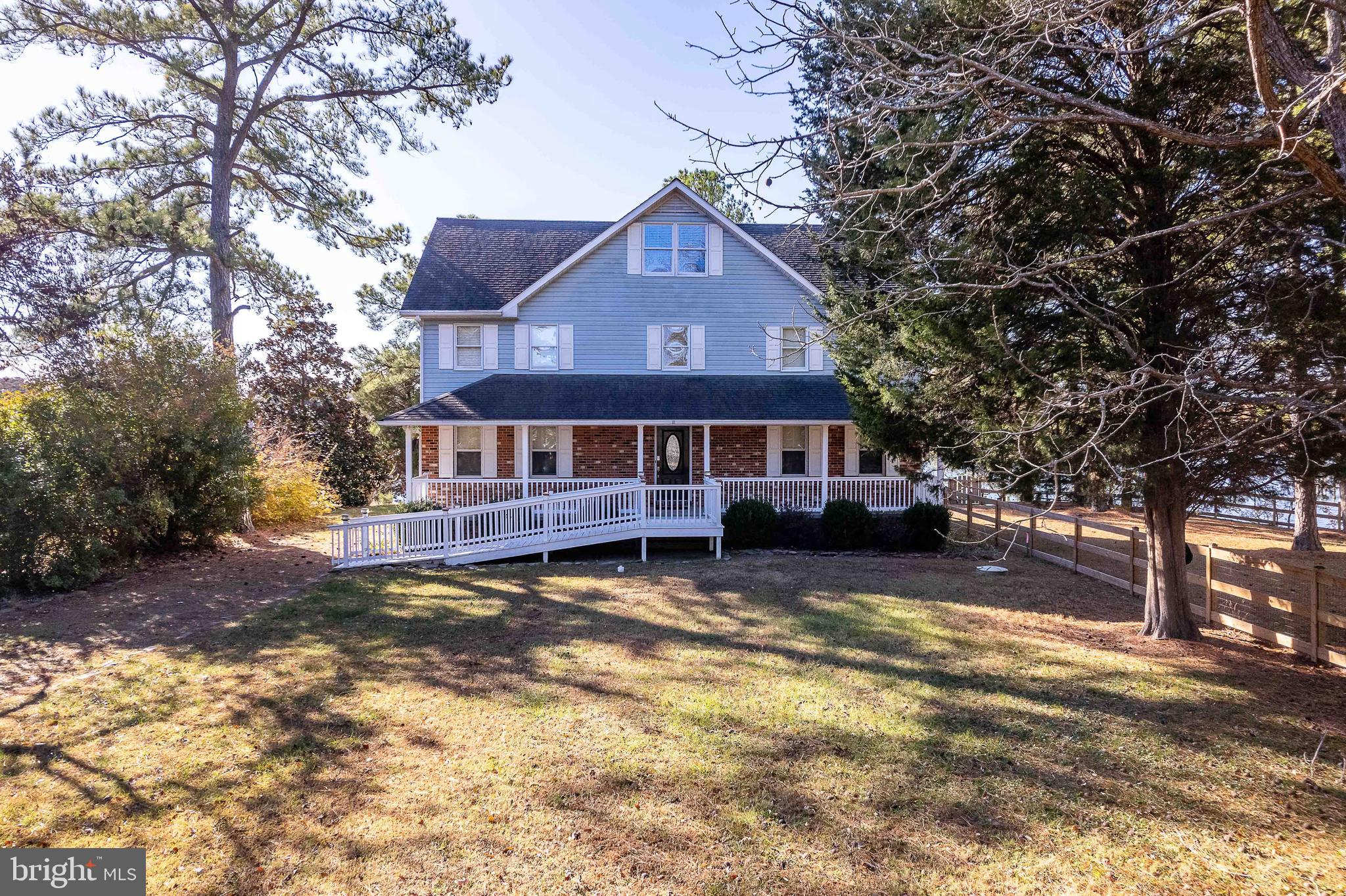 994 North Glebe Road Montross, VA 22520 - Photo 3 of 82 a front view of a house with a yard covered with snow in front of house