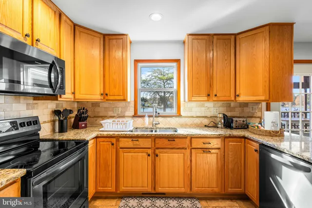 a bedroom with furniture and a flat screen tv