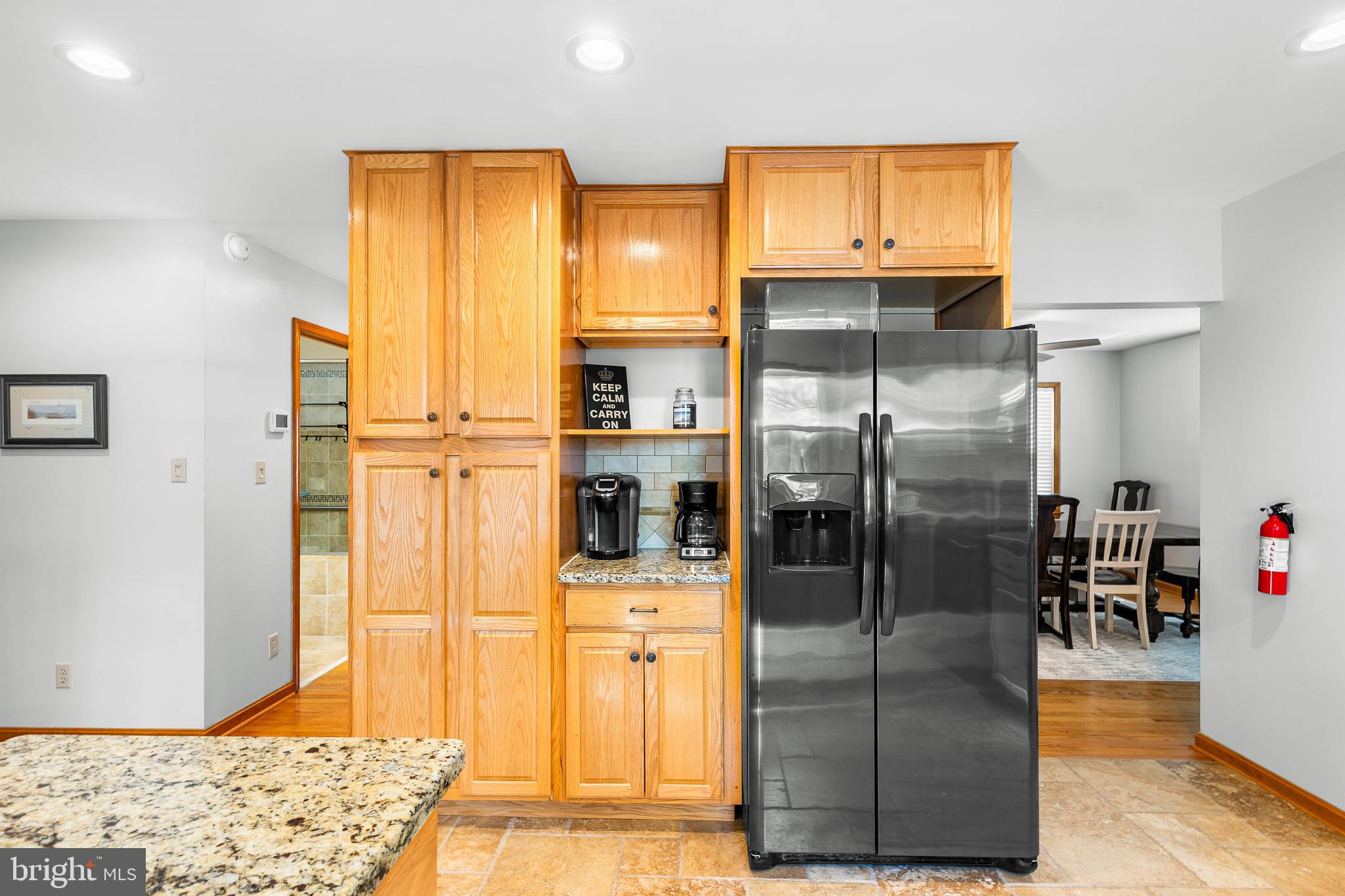 994 North Glebe Road Montross, VA 22520 - Photo 32 of 82 a kitchen with stainless steel appliances kitchen island granite countertop a refrigerator a stove and a sink with wooden floor