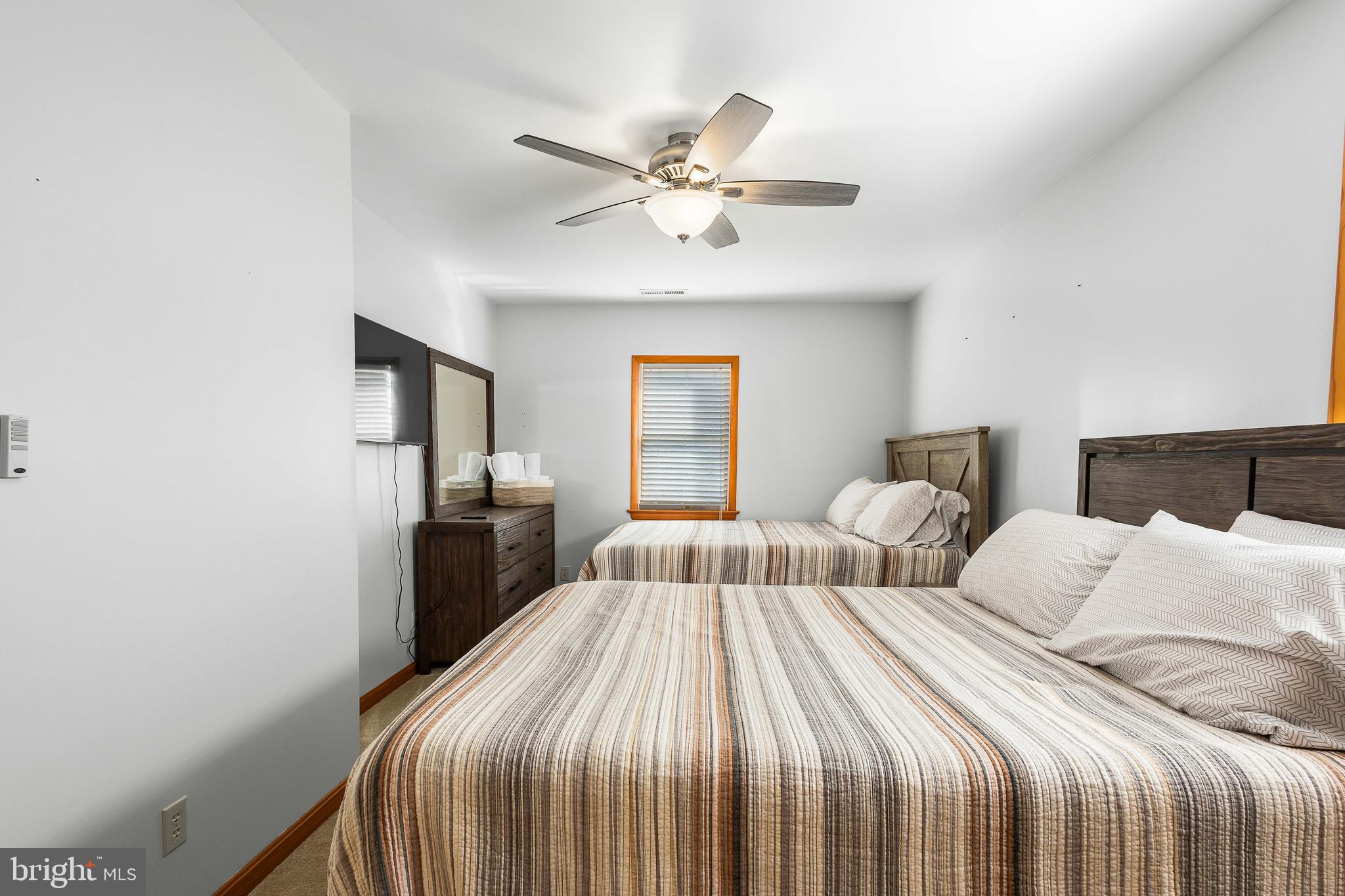 994 North Glebe Road Montross, VA 22520 - Photo 42 of 82 a bedroom with a large bed and a chandelier