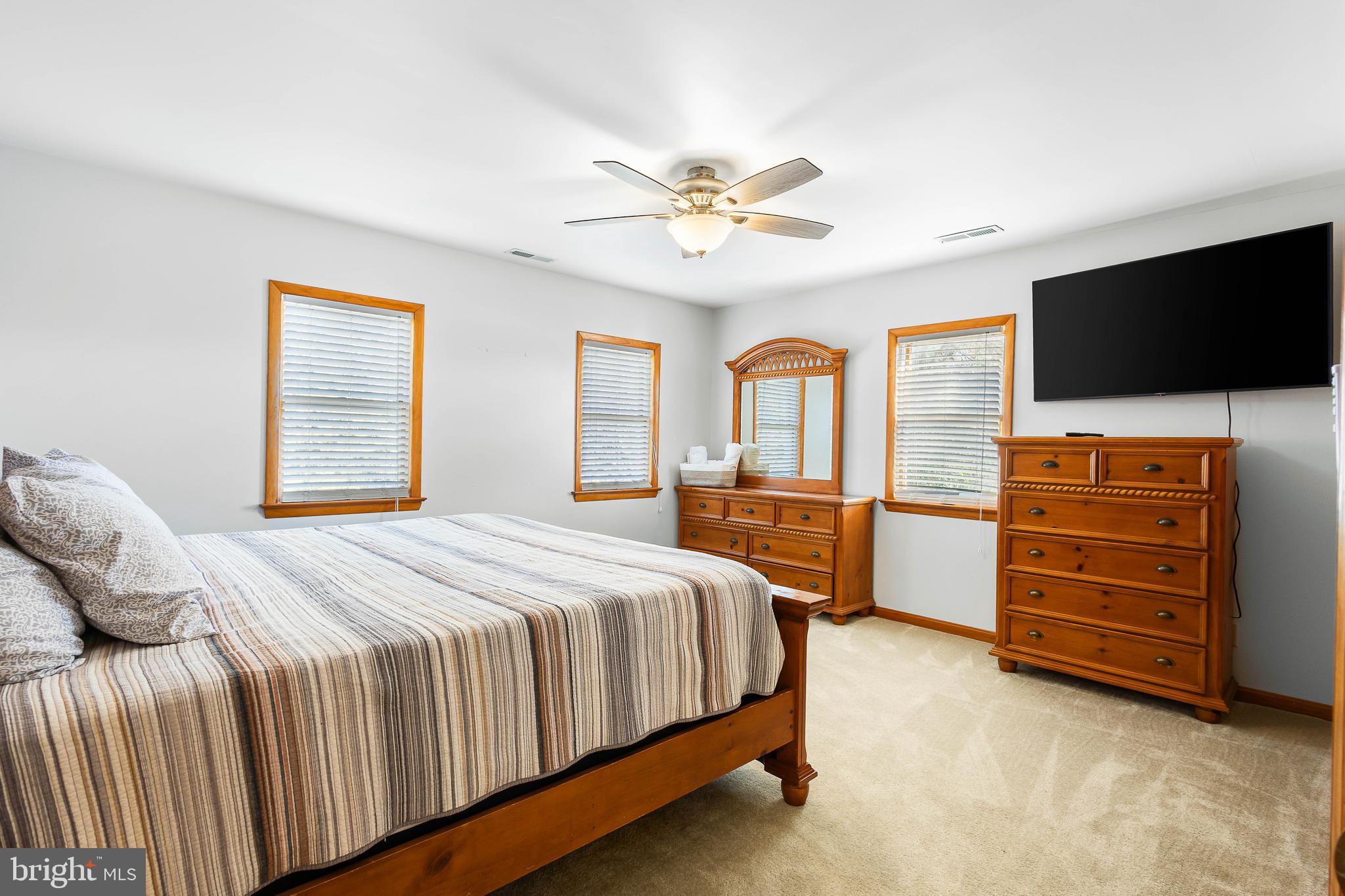 994 North Glebe Road Montross, VA 22520 - Photo 44 of 82 a bedroom with a bed and a flat screen tv