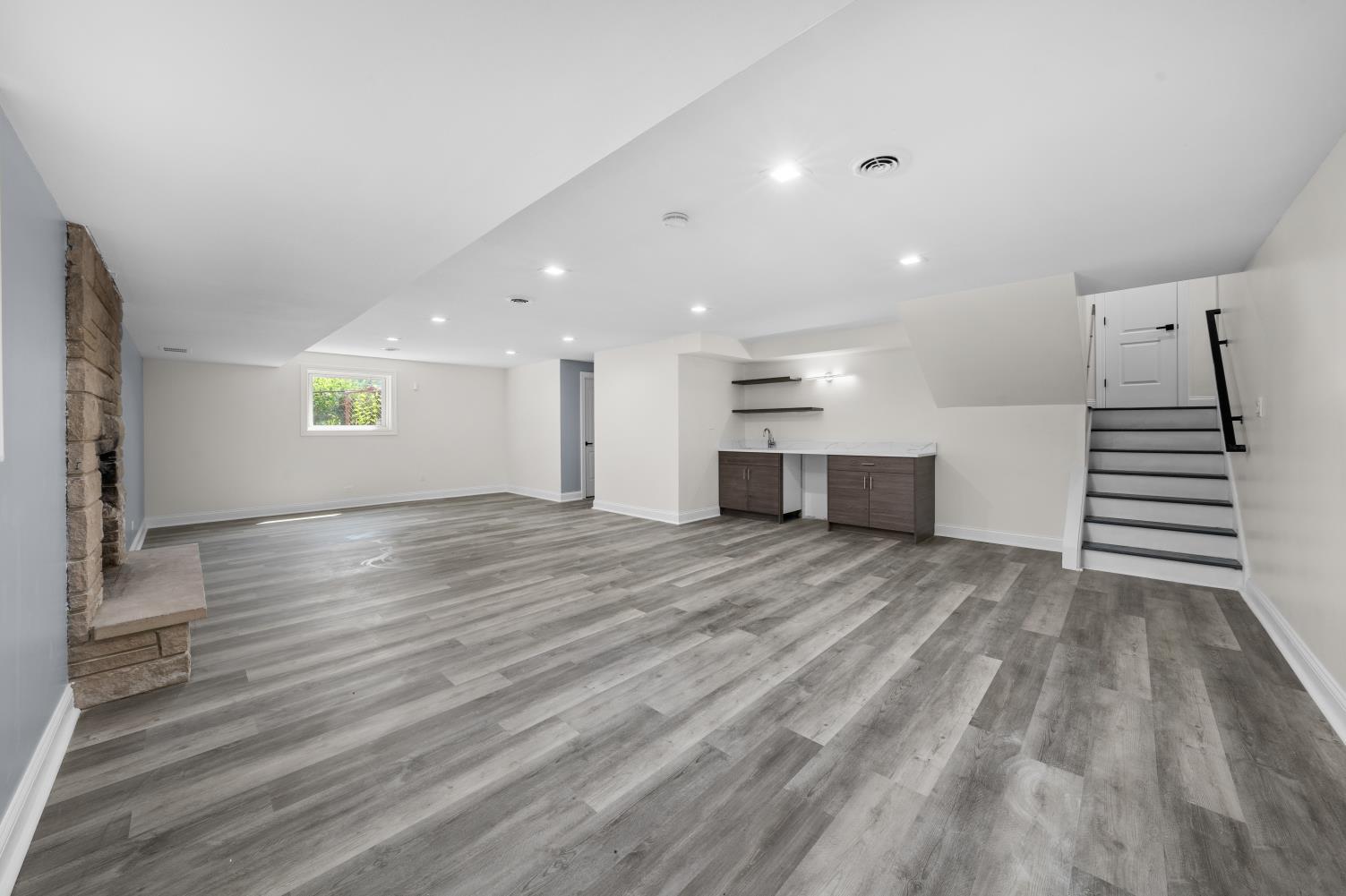 18849 Jamie Court Homewood, IL 60430 - Photo 18 of 25 a view of empty room with wooden floor and kitchen view