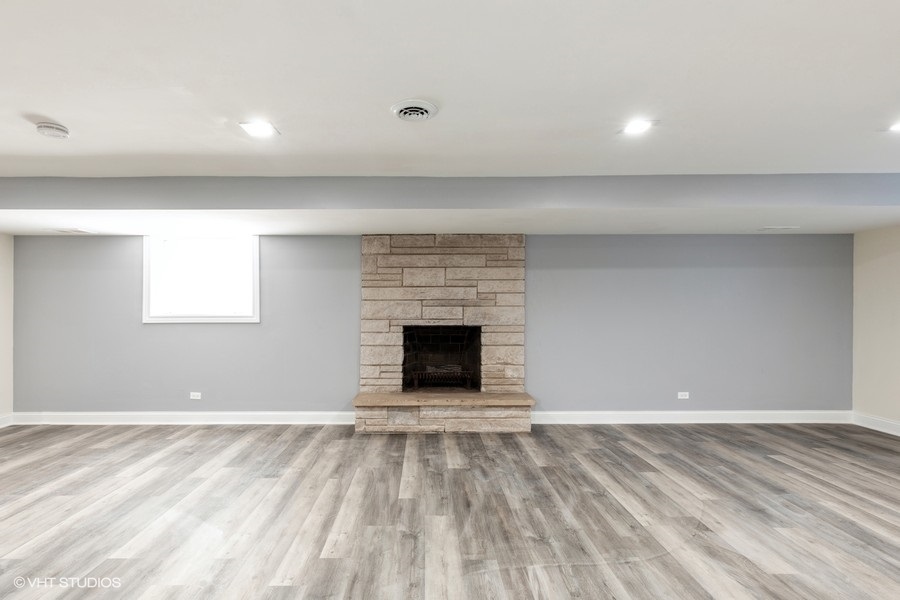 18849 Jamie Court Homewood, IL 60430 - Photo 20 of 25 a view of an empty room with a fireplace and a window