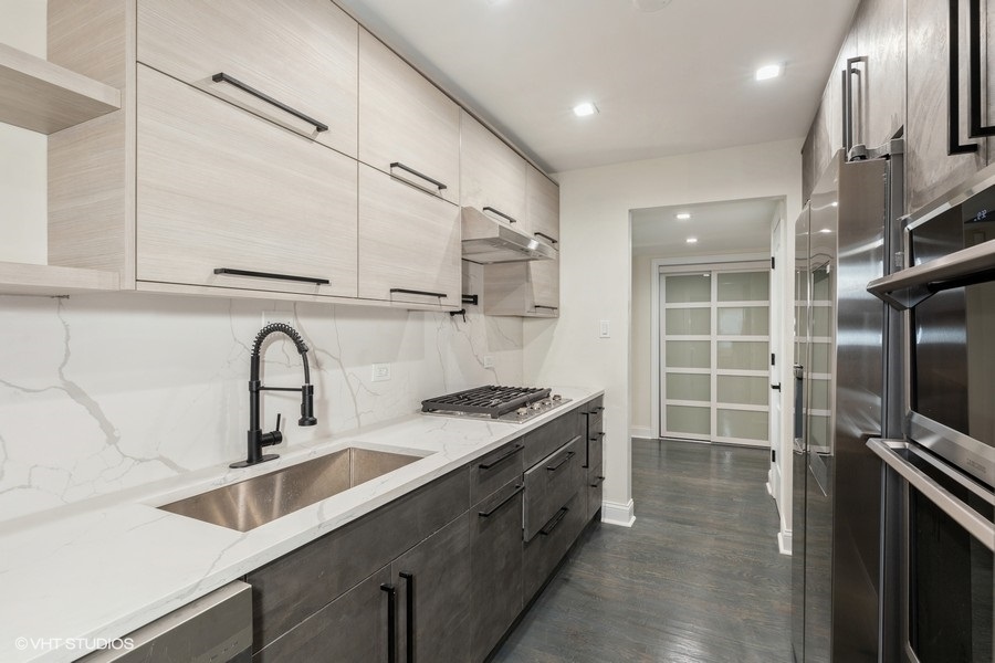 18849 Jamie Court Homewood, IL 60430 - Photo 6 of 25 a kitchen with stainless steel appliances granite countertop a sink stove and refrigerator
