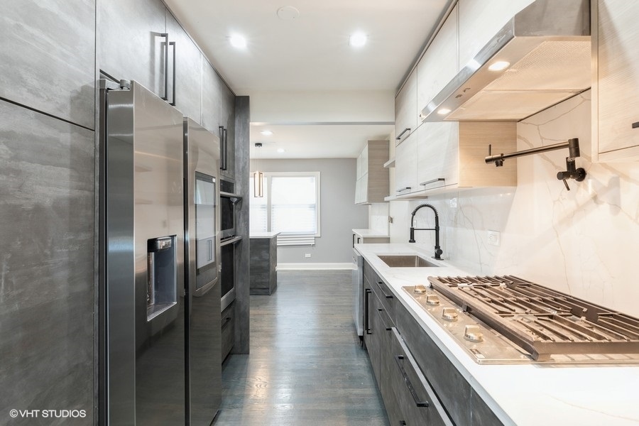18849 Jamie Court Homewood, IL 60430 - Photo 7 of 25 a kitchen with stainless steel appliances granite countertop a sink stove and refrigerator