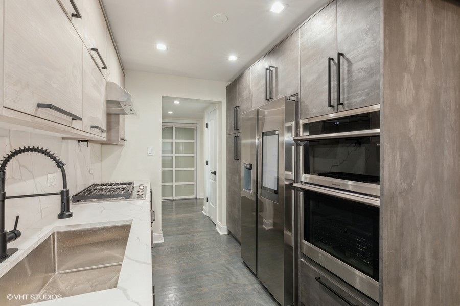 18849 Jamie Court Homewood, IL 60430 - Photo 8 of 25 a kitchen with stainless steel appliances granite countertop a refrigerator and a stove top oven