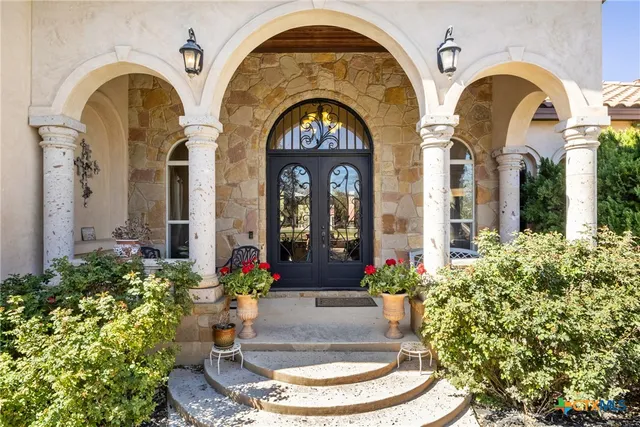 a front view of a house with lots of yellow lighting