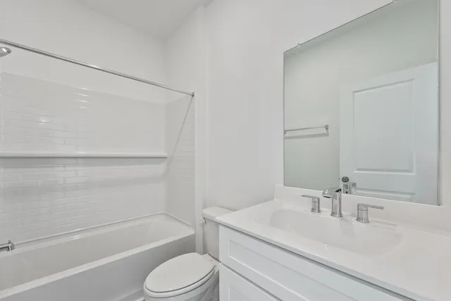 a bathroom with a sink toilet and a bathtub