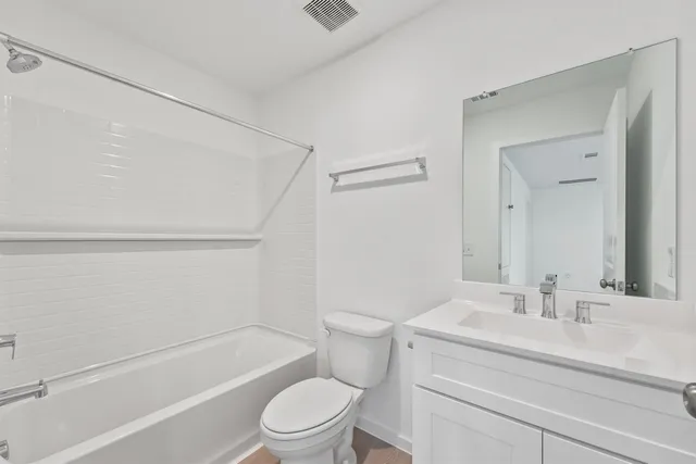 a bathroom with a sink a toilet and a bathtub