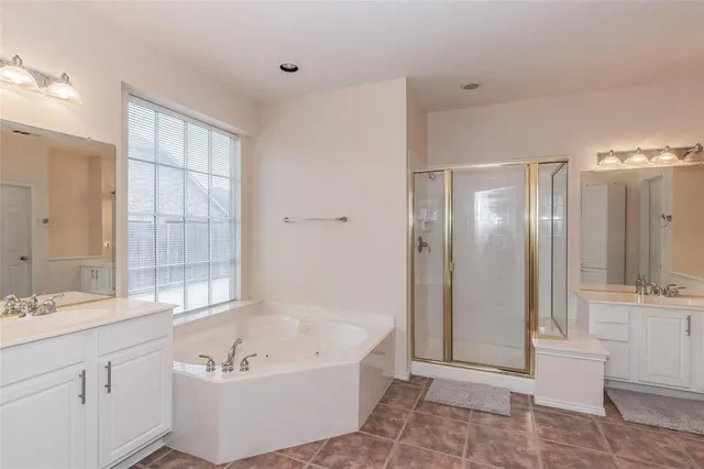 a bathroom with a bathtub and a sink