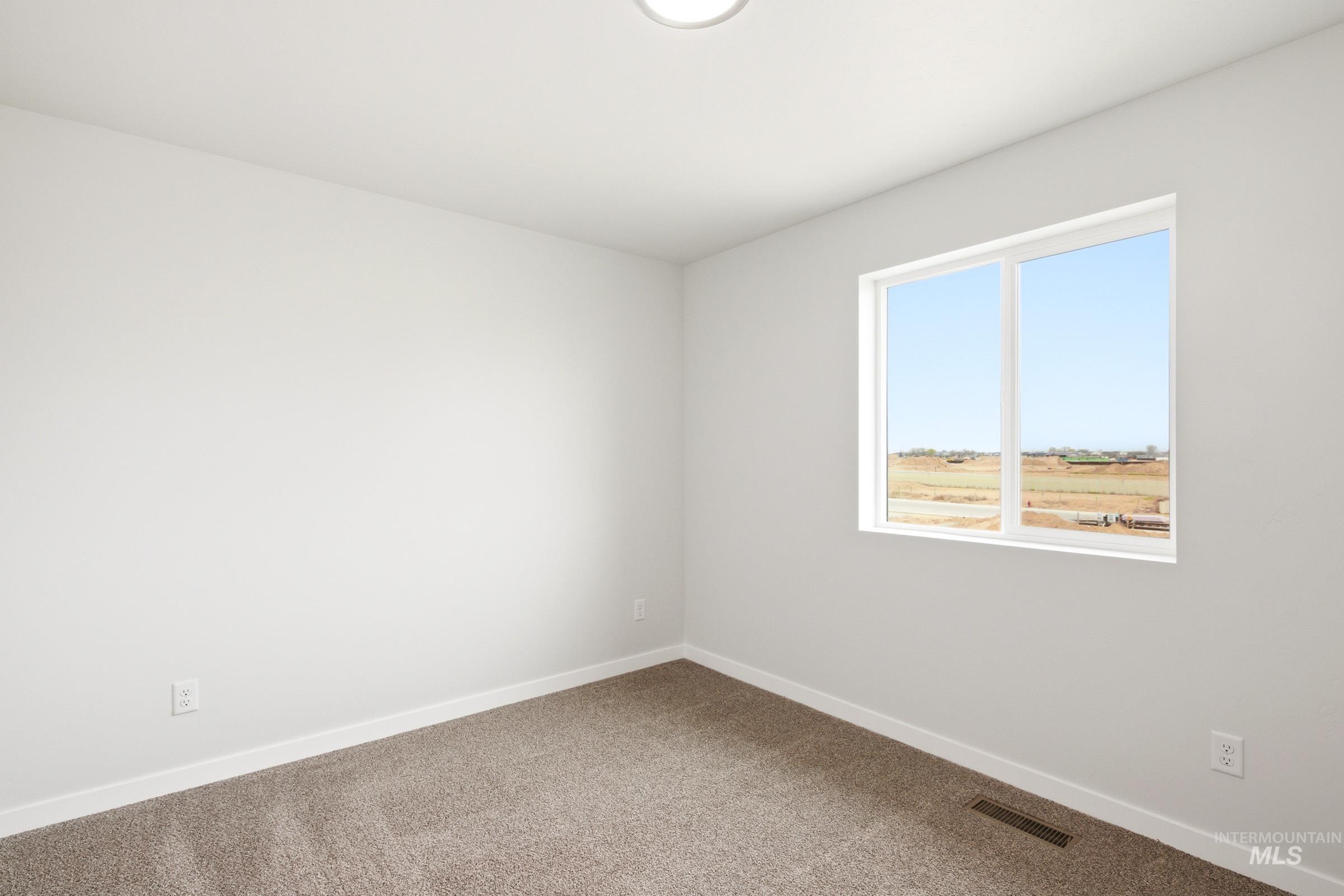 10776 Rutland Street Caldwell, ID 83605 - Photo 12 of 22 Carpeted empty room with baseboards