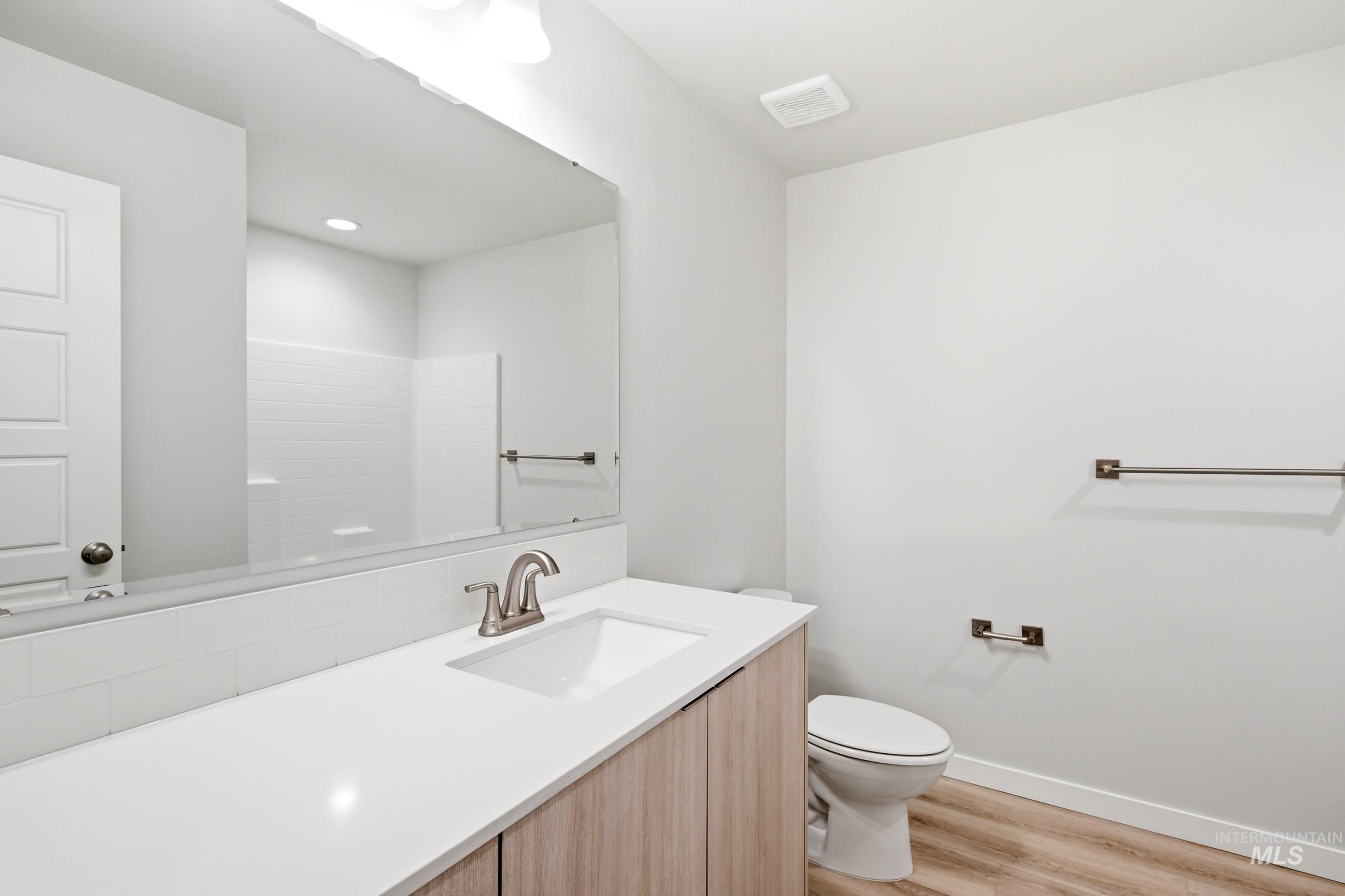 10776 Rutland Street Caldwell, ID 83605 - Photo 14 of 22 Bathroom featuring vanity and light wood finished floors