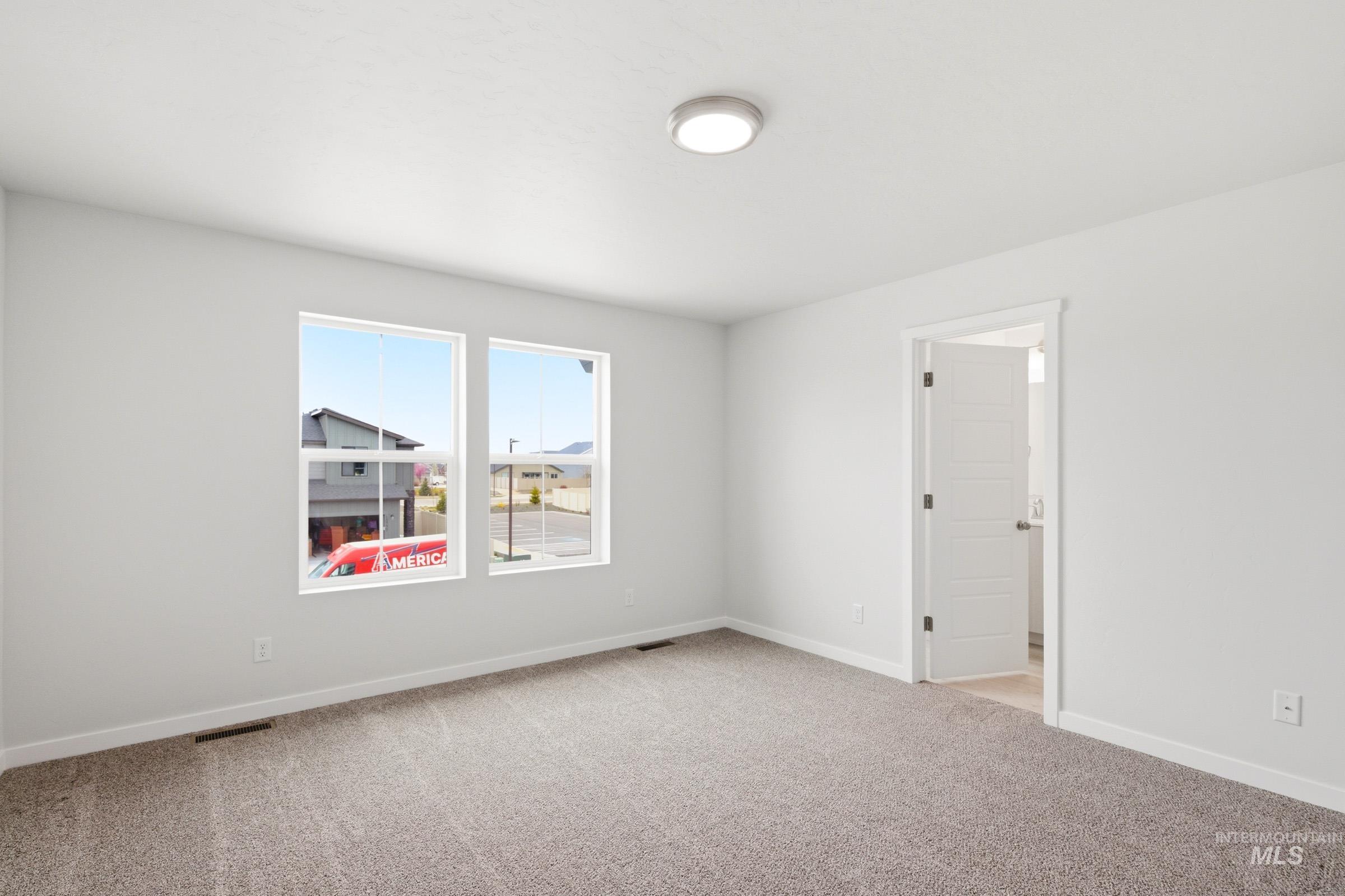 10776 Rutland Street Caldwell, ID 83605 - Photo 16 of 22 Spare room featuring light colored carpet and baseboards