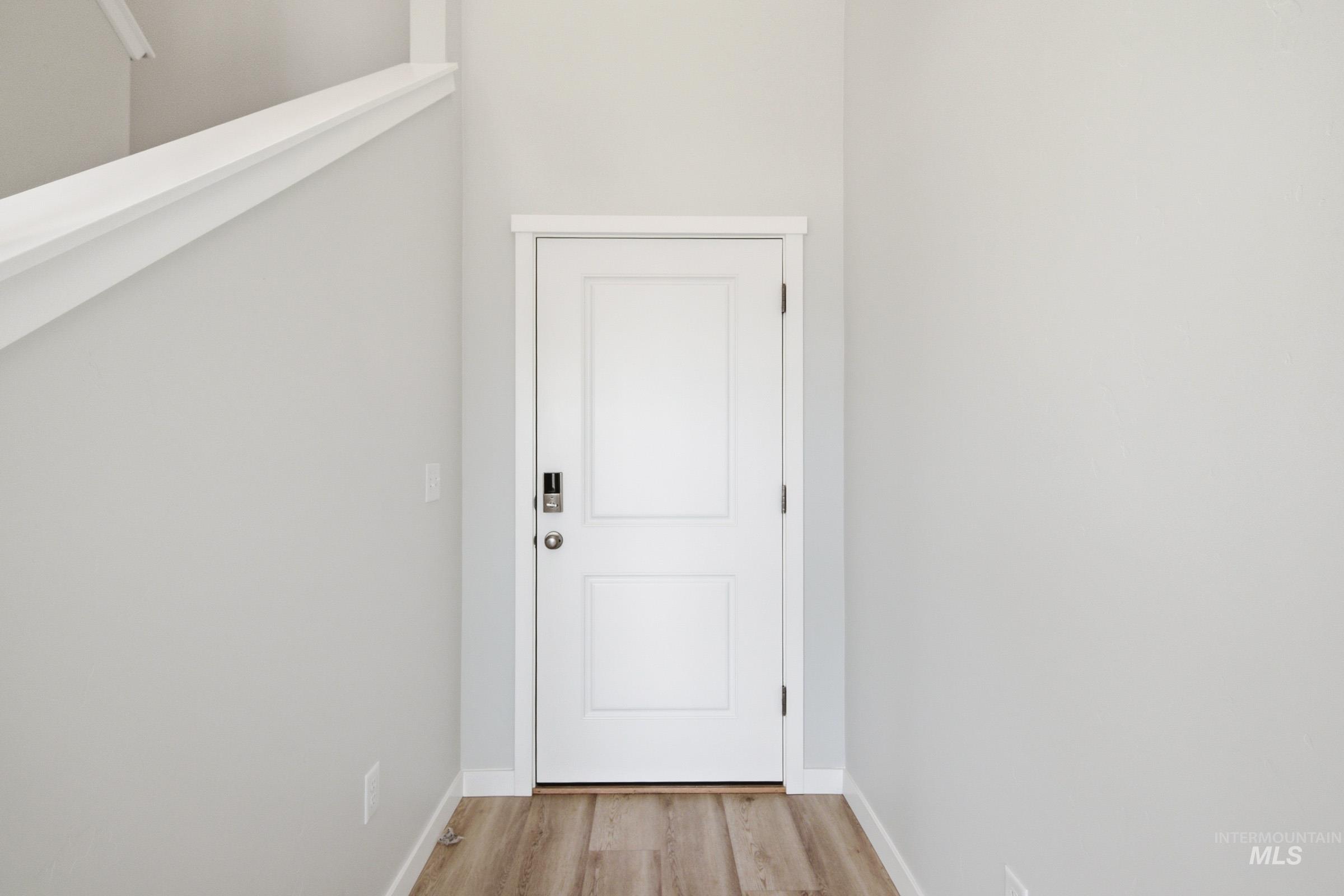 10776 Rutland Street Caldwell, ID 83605 - Photo 2 of 22 Doorway with wood finished floors and baseboards