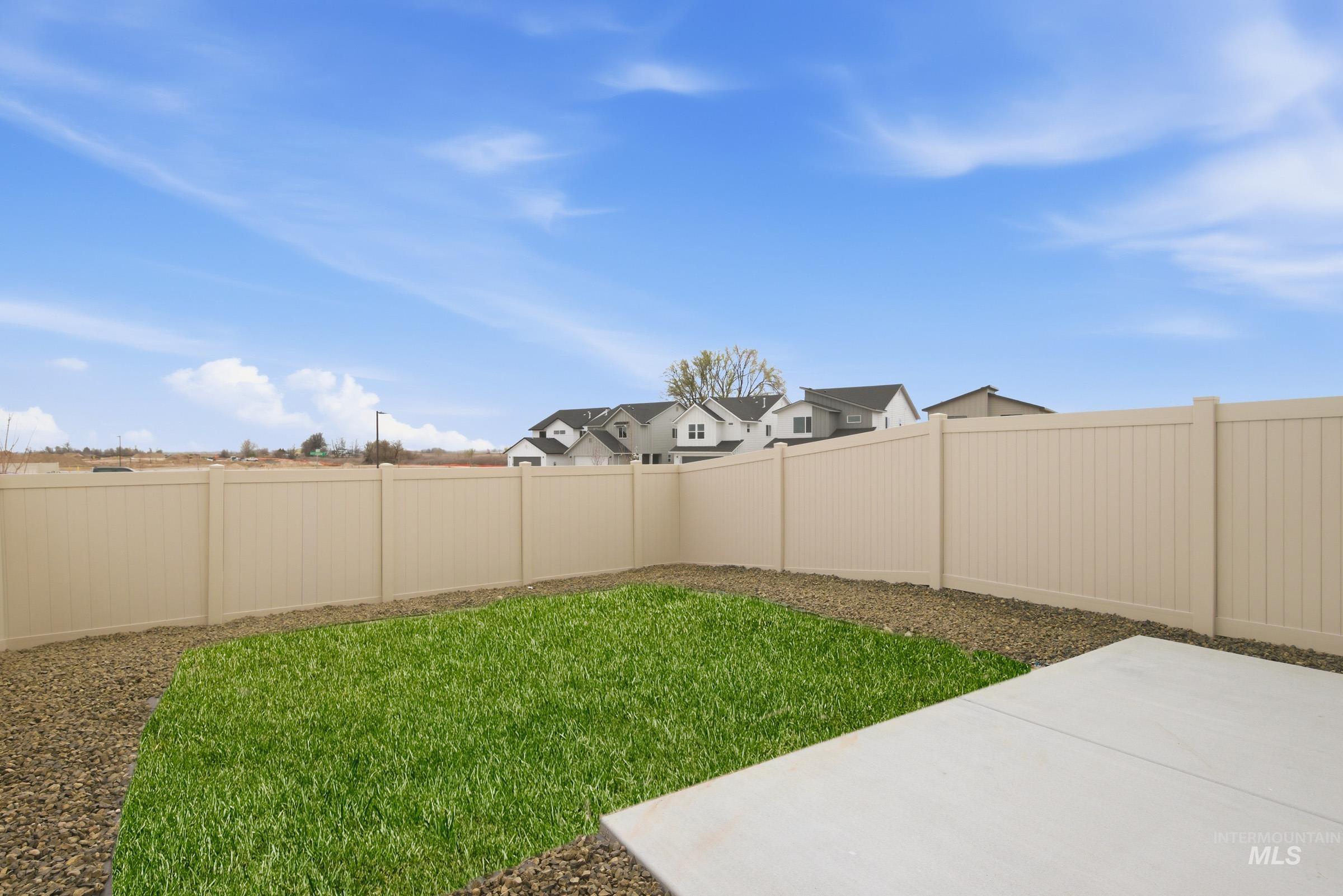 10776 Rutland Street Caldwell, ID 83605 - Photo 20 of 22 Fenced backyard with a patio and a residential view