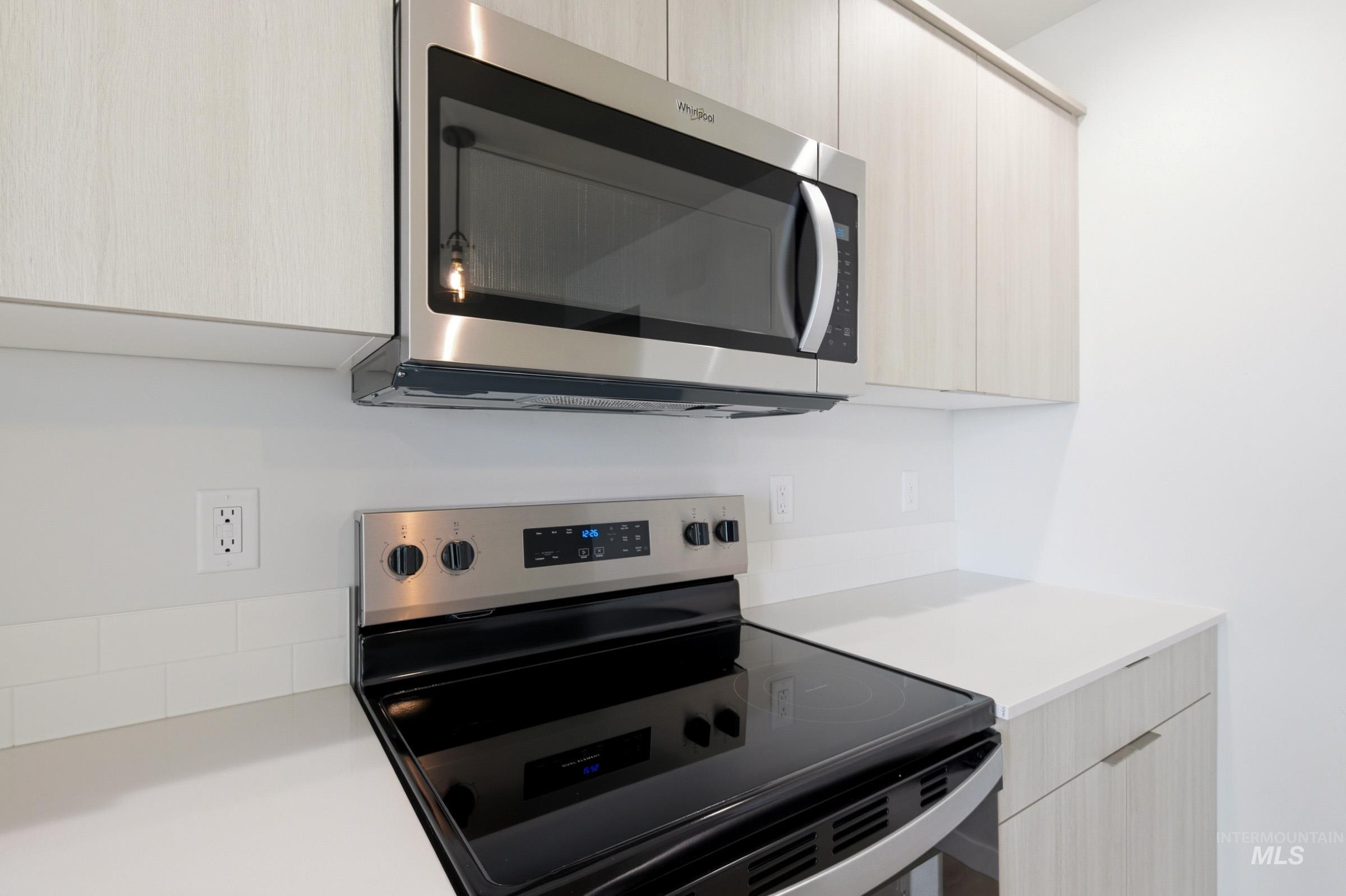 10776 Rutland Street Caldwell, ID 83605 - Photo 7 of 22 Kitchen featuring stainless steel appliances, modern cabinets, and light wood finish cabinets