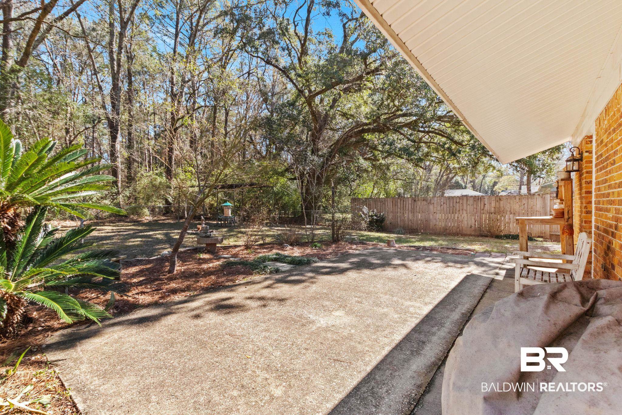 5366 Scanlan Way West Satsuma, AL 36572 - Photo 41 of 43 Fenced backyard with a patio area
