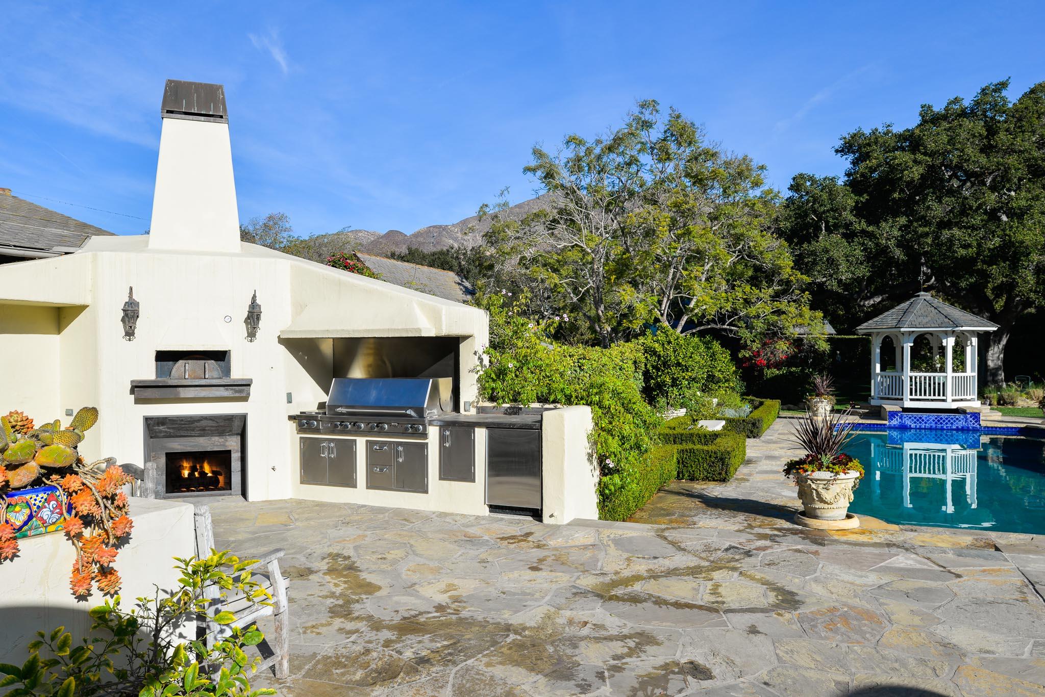 1570 East Valley Road Montecito, CA 93108 - Photo 12 of 23 a front view of a house with a garden