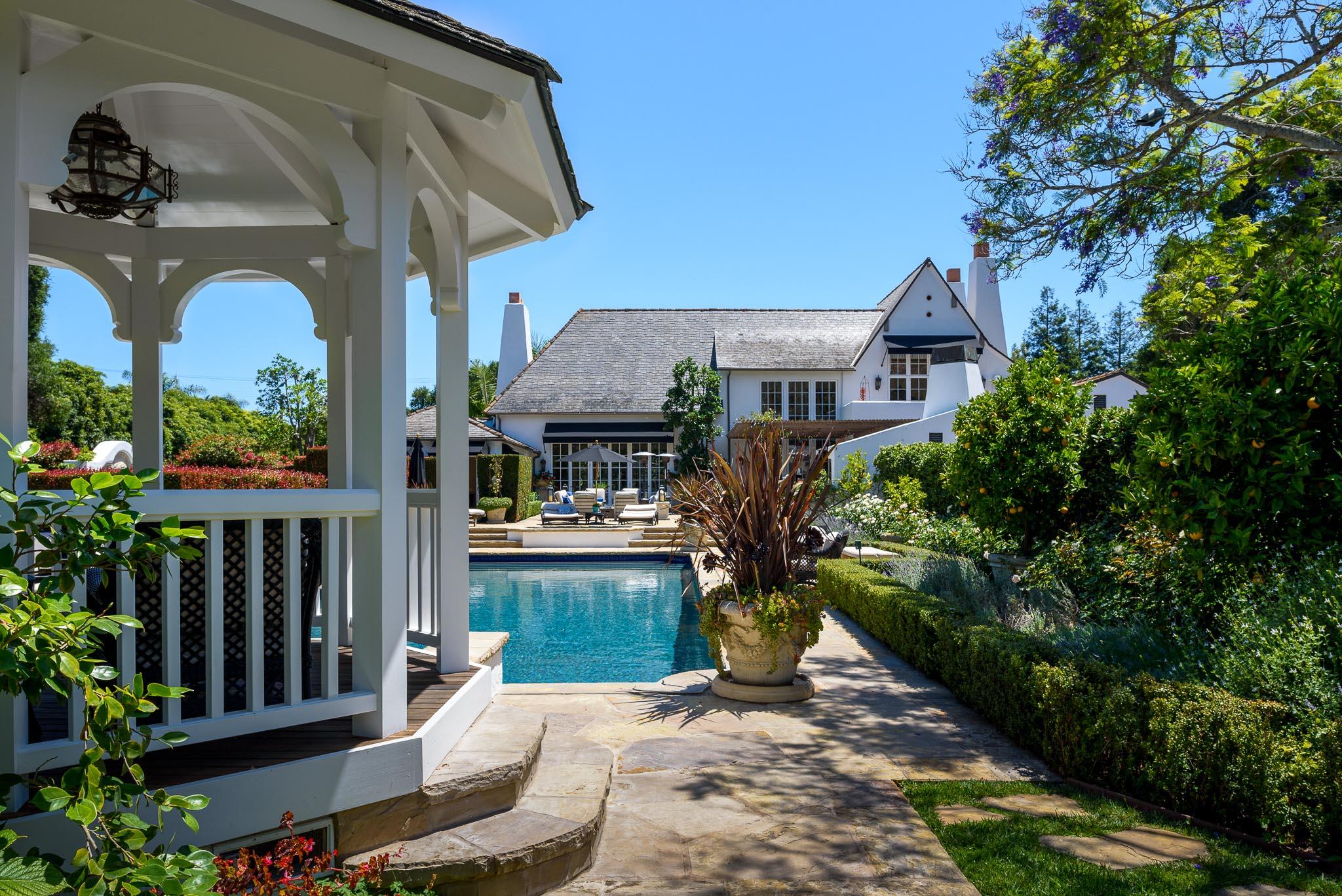 1570 East Valley Road Montecito, CA 93108 - Photo 19 of 23 a front view of house and yard with beautiful flowers