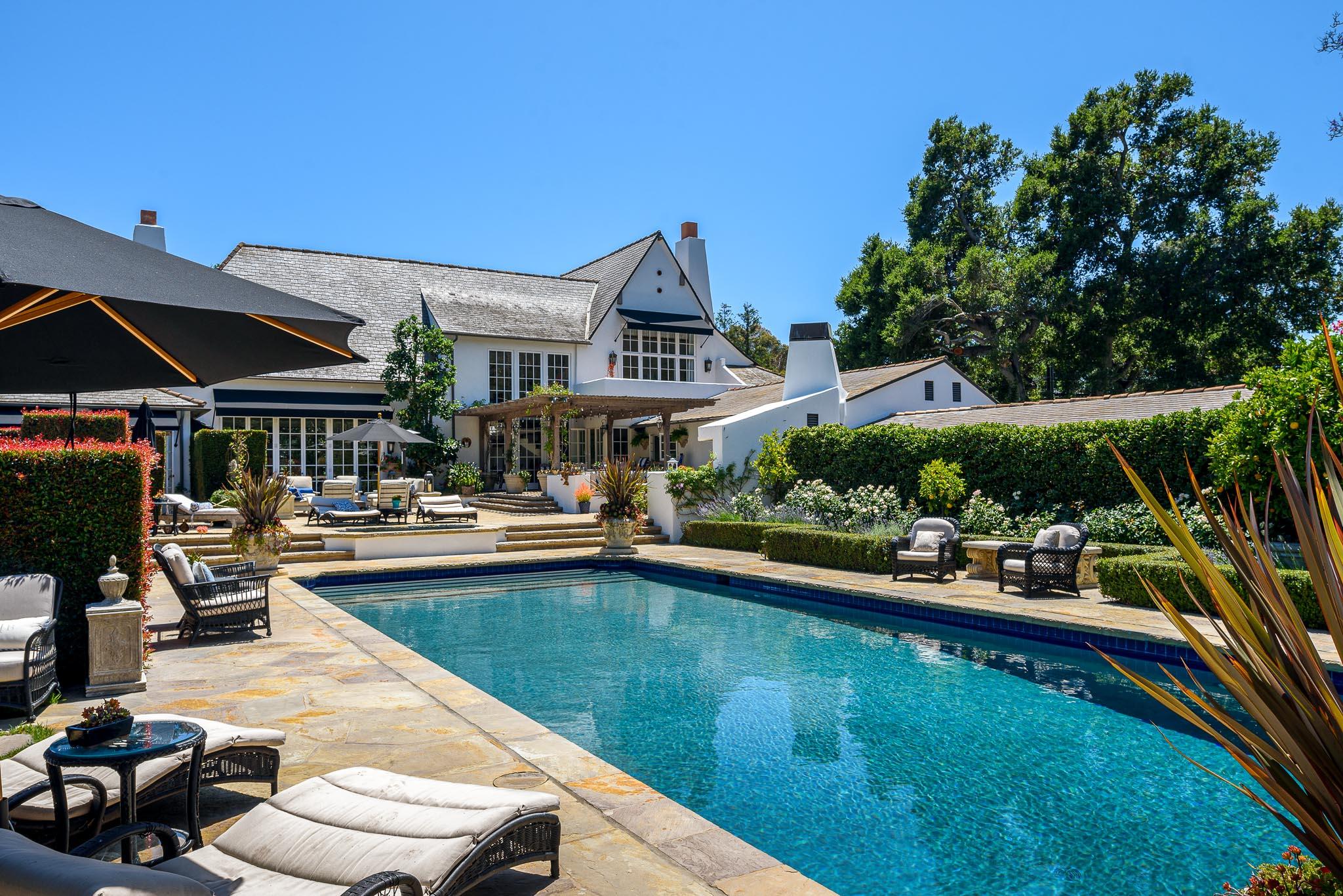 1570 East Valley Road Montecito, CA 93108 - Photo 2 of 23 a view of a patio with swimming pool table and chairs