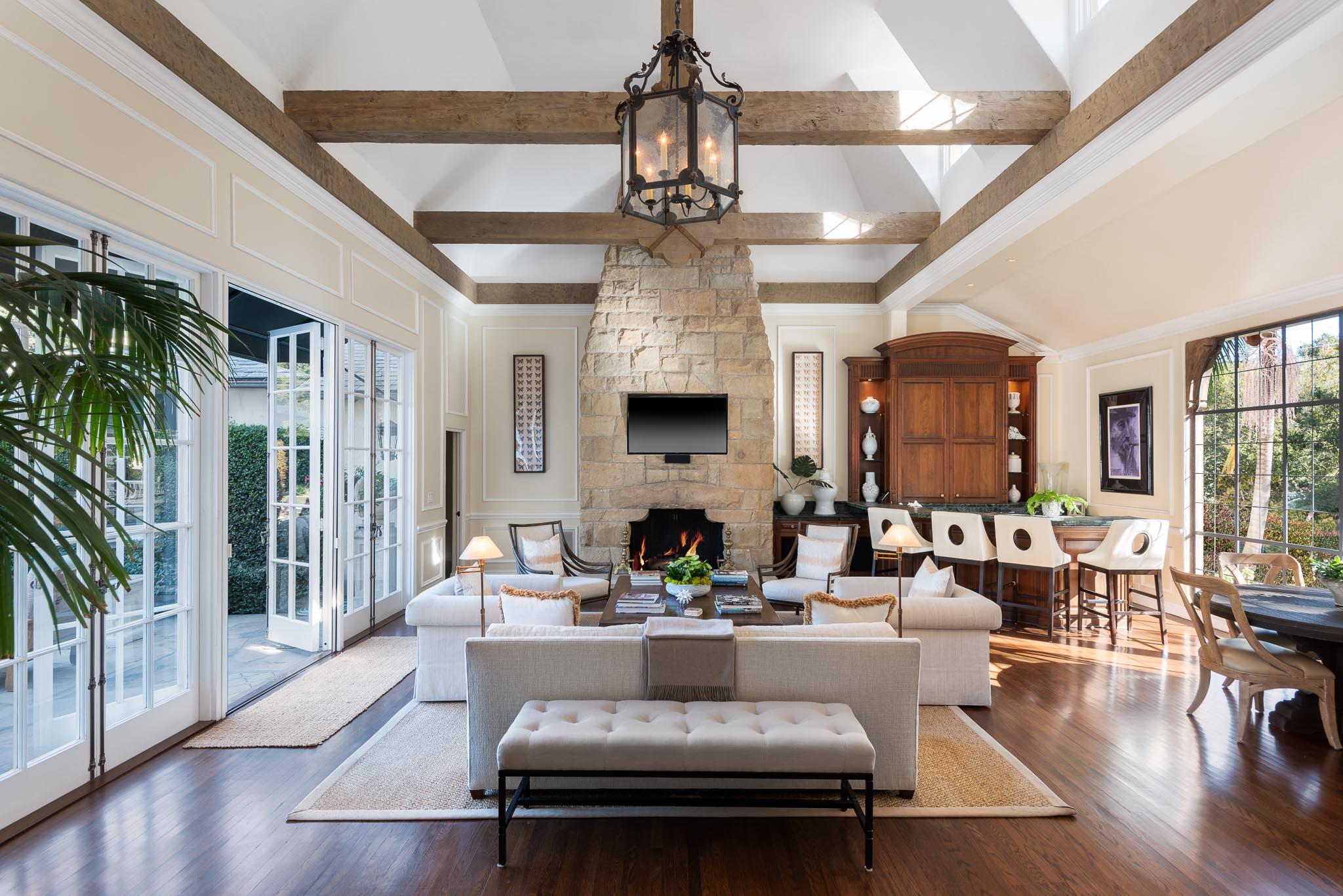 1570 East Valley Road Montecito, CA 93108 - Photo 3 of 23 a living room with fireplace furniture and a chandelier