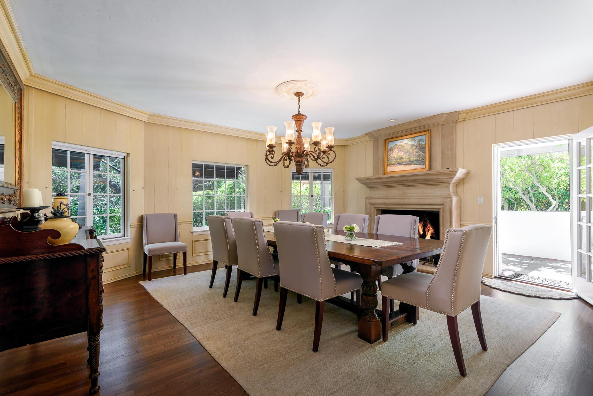1570 East Valley Road Montecito, CA 93108 - Photo 4 of 23 a dining room with furniture a chandelier and wooden floor