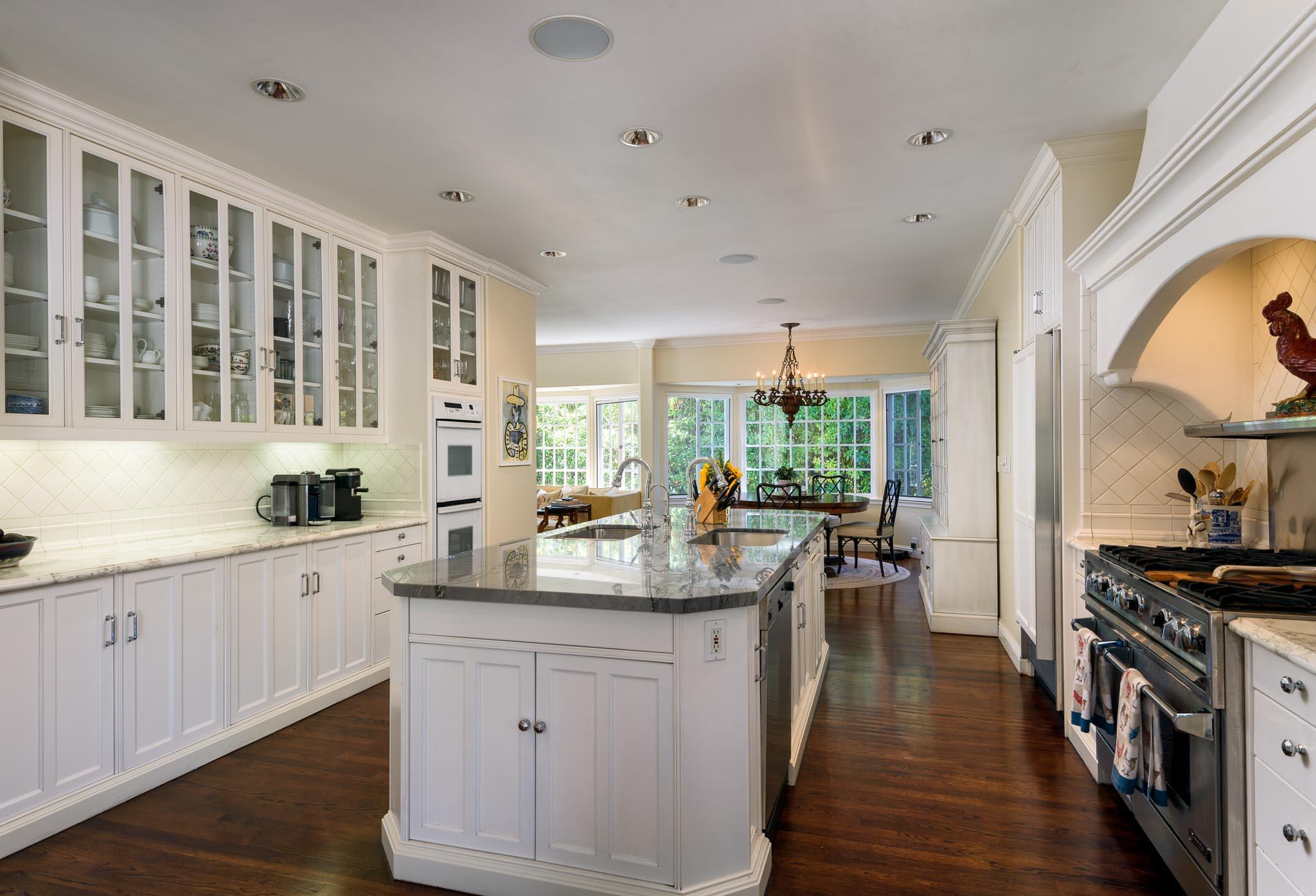 1570 East Valley Road Montecito, CA 93108 - Photo 5 of 23 a kitchen with sink stove and cabinets