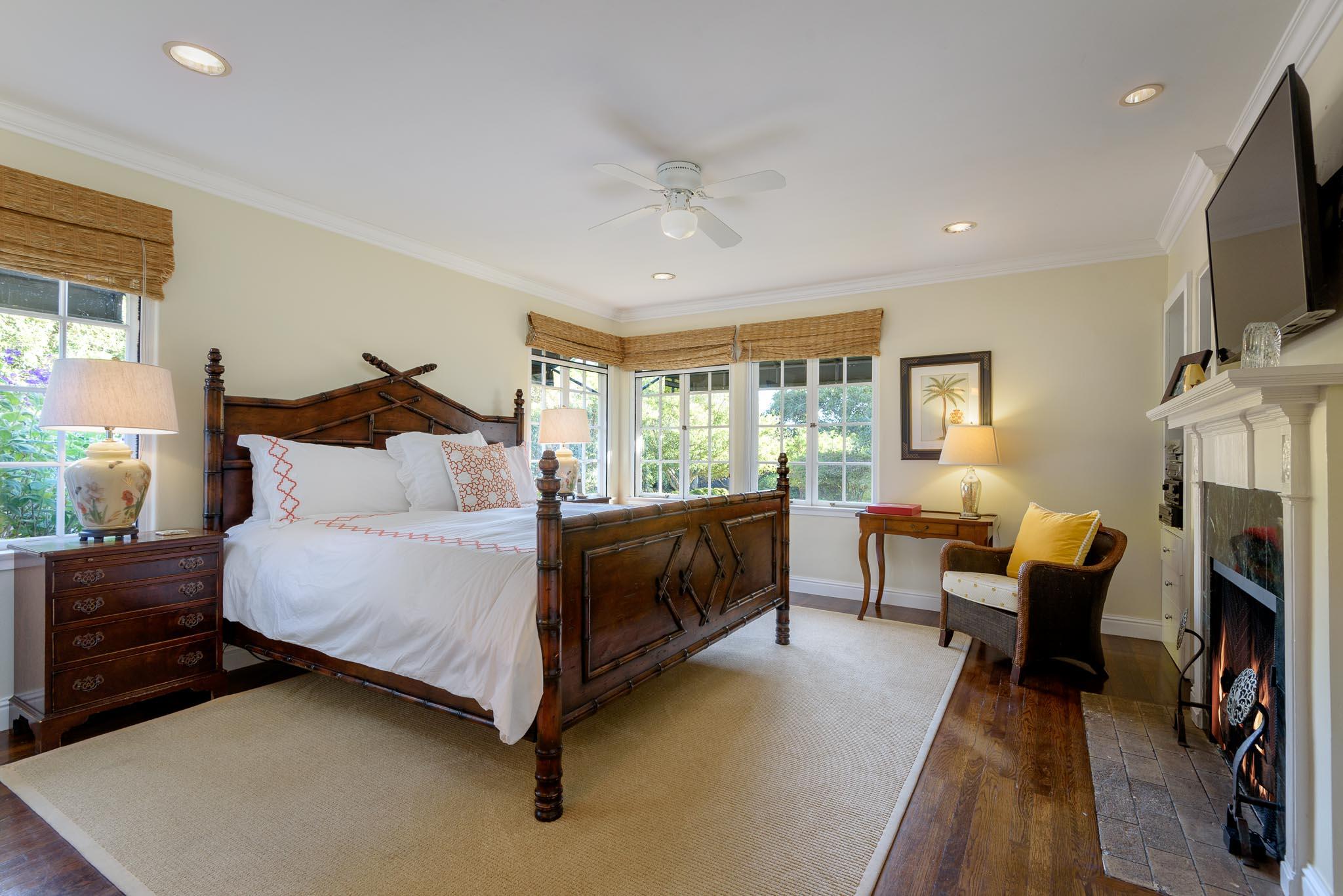 1570 East Valley Road Montecito, CA 93108 - Photo 10 of 23 a bedroom with a bed and a flat screen tv