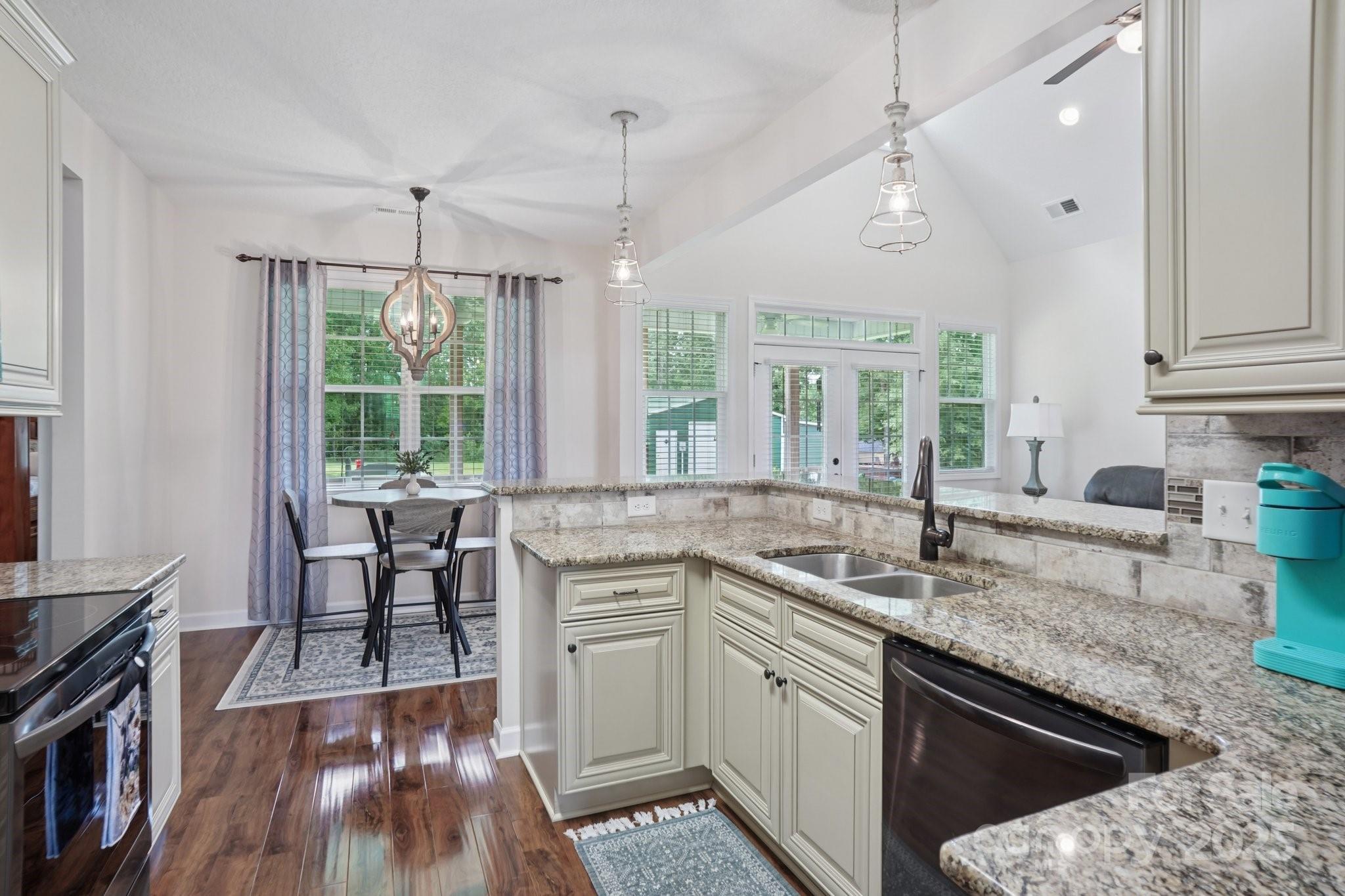 2209 Cedar Road York, SC 29745 - Photo 14 of 48 a kitchen with stainless steel appliances granite countertop a sink stove and cabinets