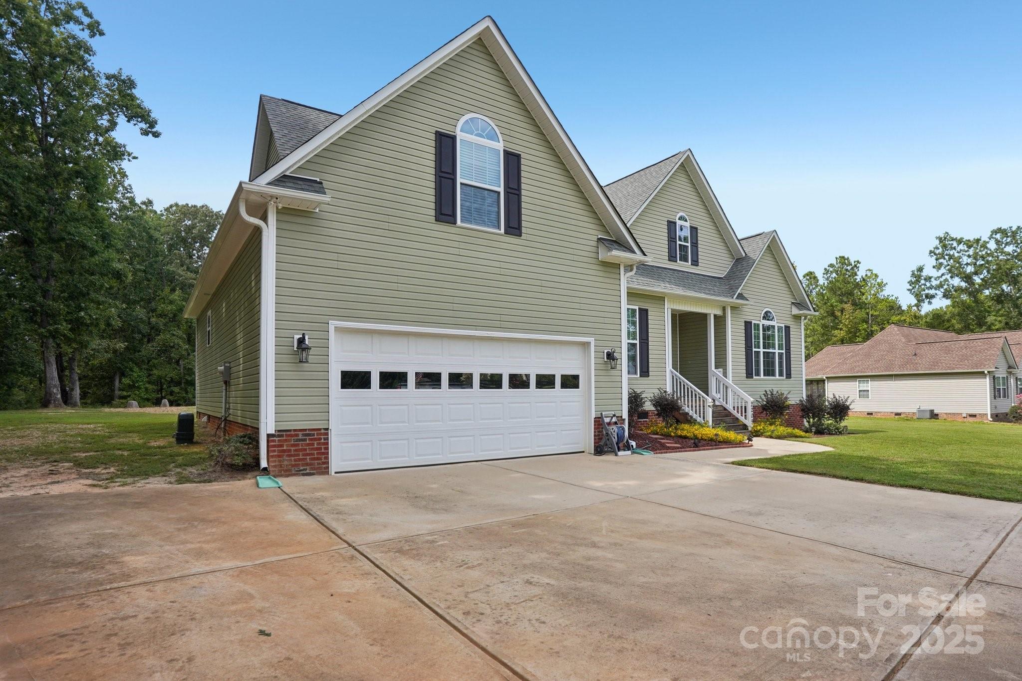2209 Cedar Road York, SC 29745 - Photo 2 of 48 a view of an house with backyard and bushes