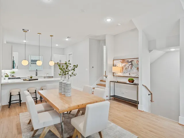a kitchen with a table and chairs in it
