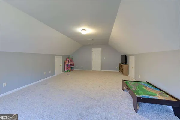 a view of a livingroom with furniture and a fireplace