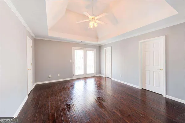 a view of balcony with wooden floor and fence
