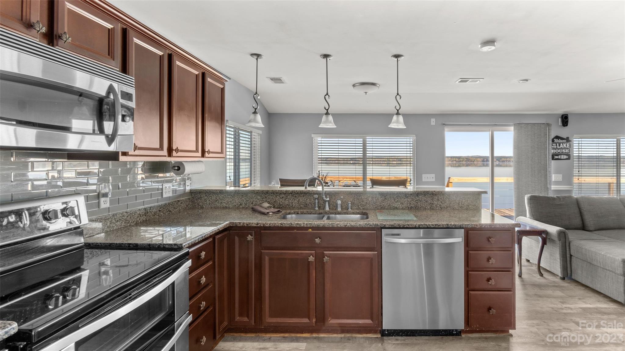 70 Rainbow Cove Ridgeway, SC 29130 - Photo 5 of 28 a kitchen with granite countertop a sink and a stove