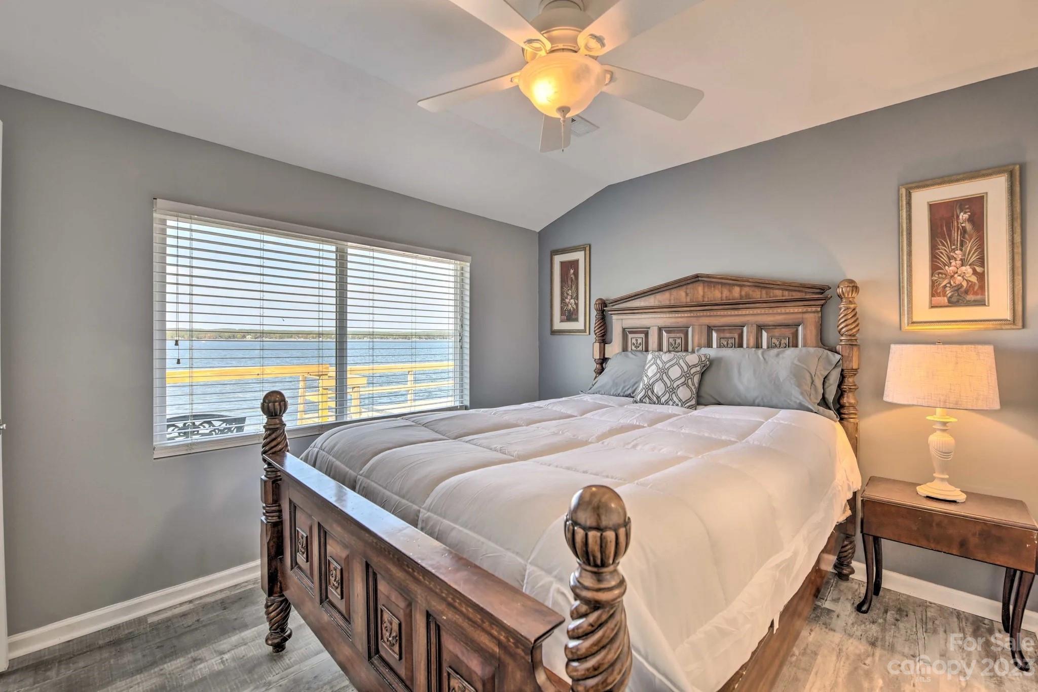 70 Rainbow Cove Ridgeway, SC 29130 - Photo 9 of 28 a bedroom with a bed and a chandelier