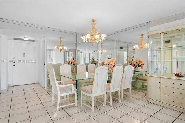 a view of a dining room and chandelier