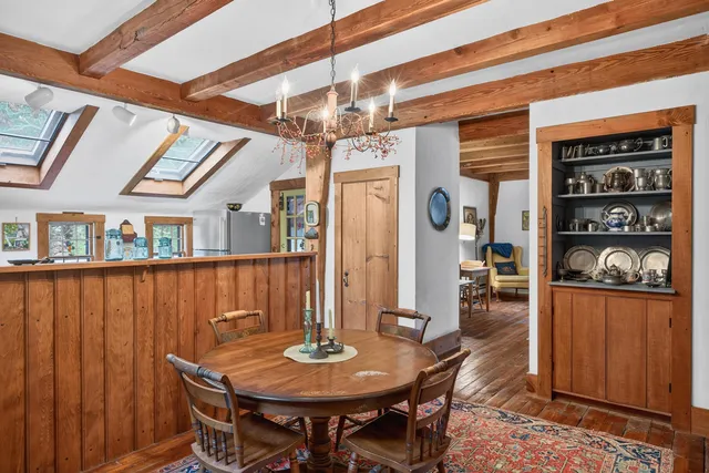 a dining room with furniture and window