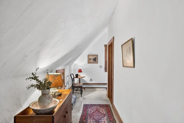 a living room with furniture and a rug